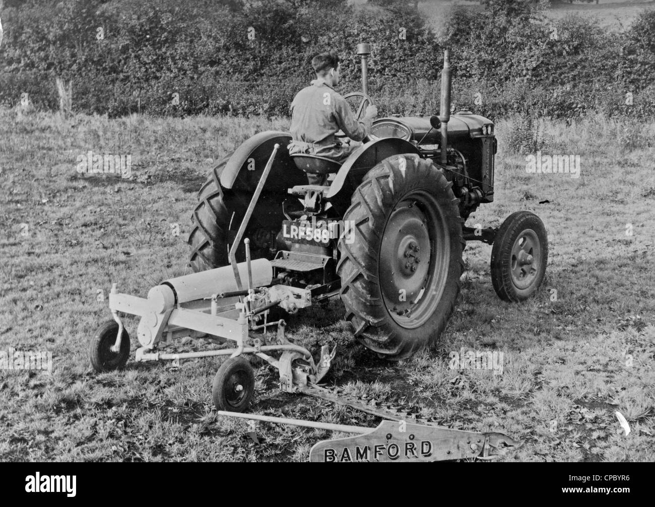Early power mower tested and approved by the Ford Motor Company Ltd, this mower was manufactured exclusively for the Fordson Major Tractor by Bamfords Limited. From the archives of Press Portrait Service (formerly Press Portrait Bureau) Stock Photo