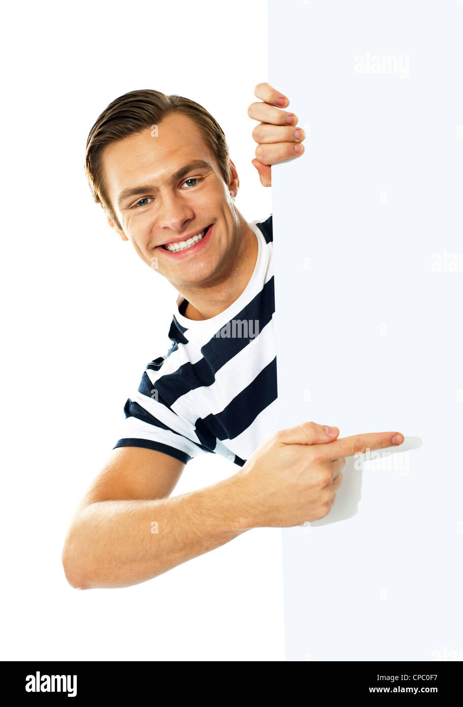 Handsome person pointing on blank signboard isolated against white background Stock Photo