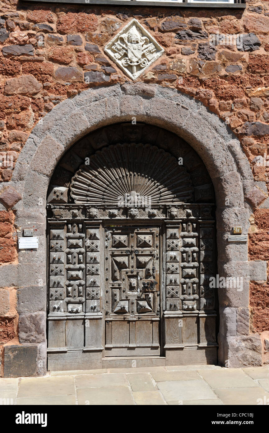 Carved wooden door in Cathedral Close Exeter Devon UK Stock Photo