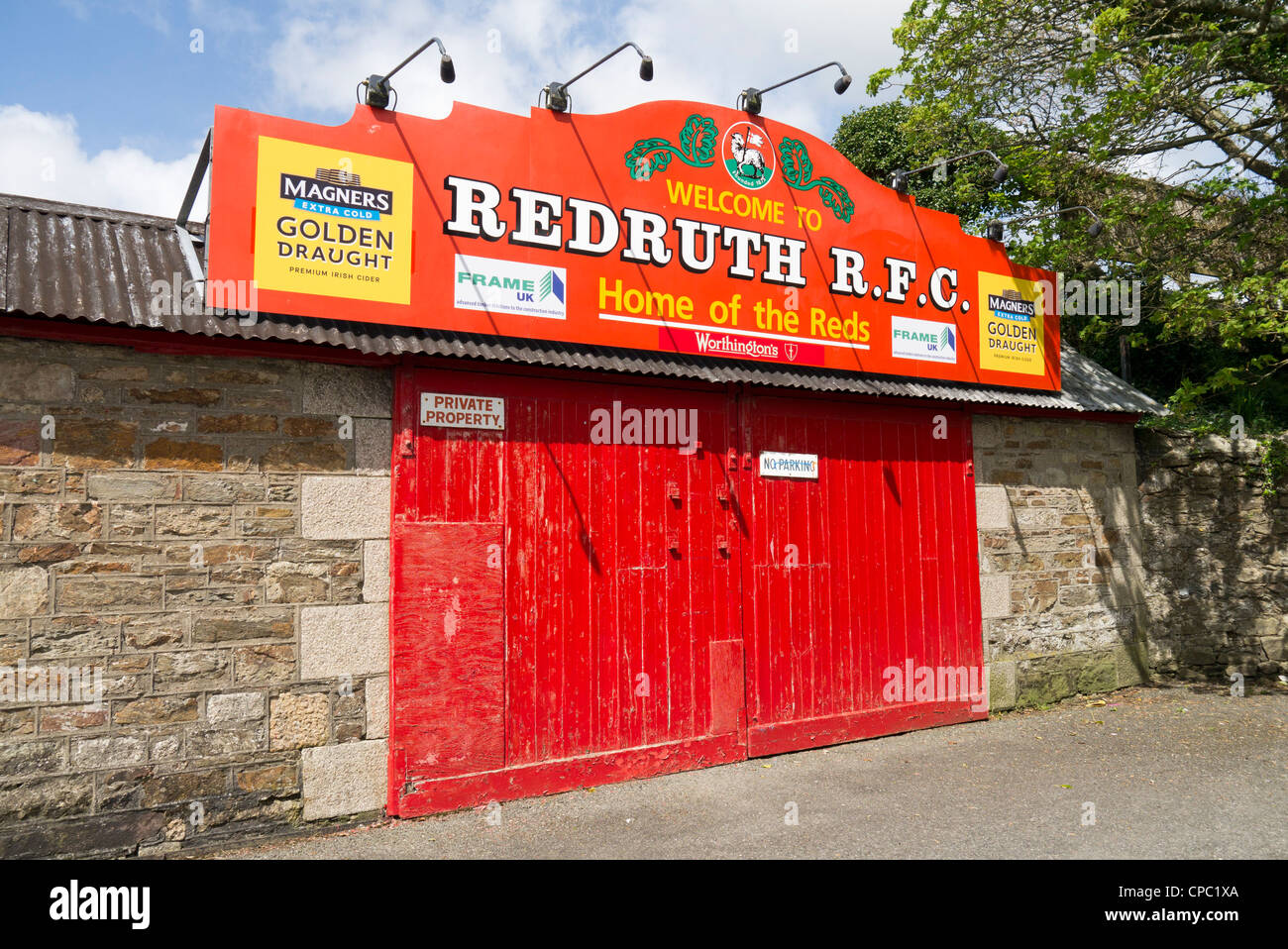 Redruth Rugby Football Club colourful red entrance doors, Cornwall UK. Stock Photo