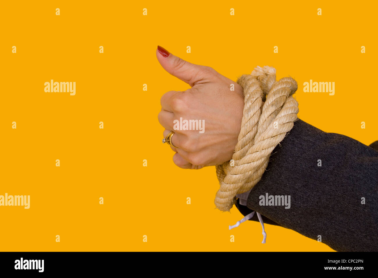 a businesswoman with her hands tied for a corporate crime Stock Photo
