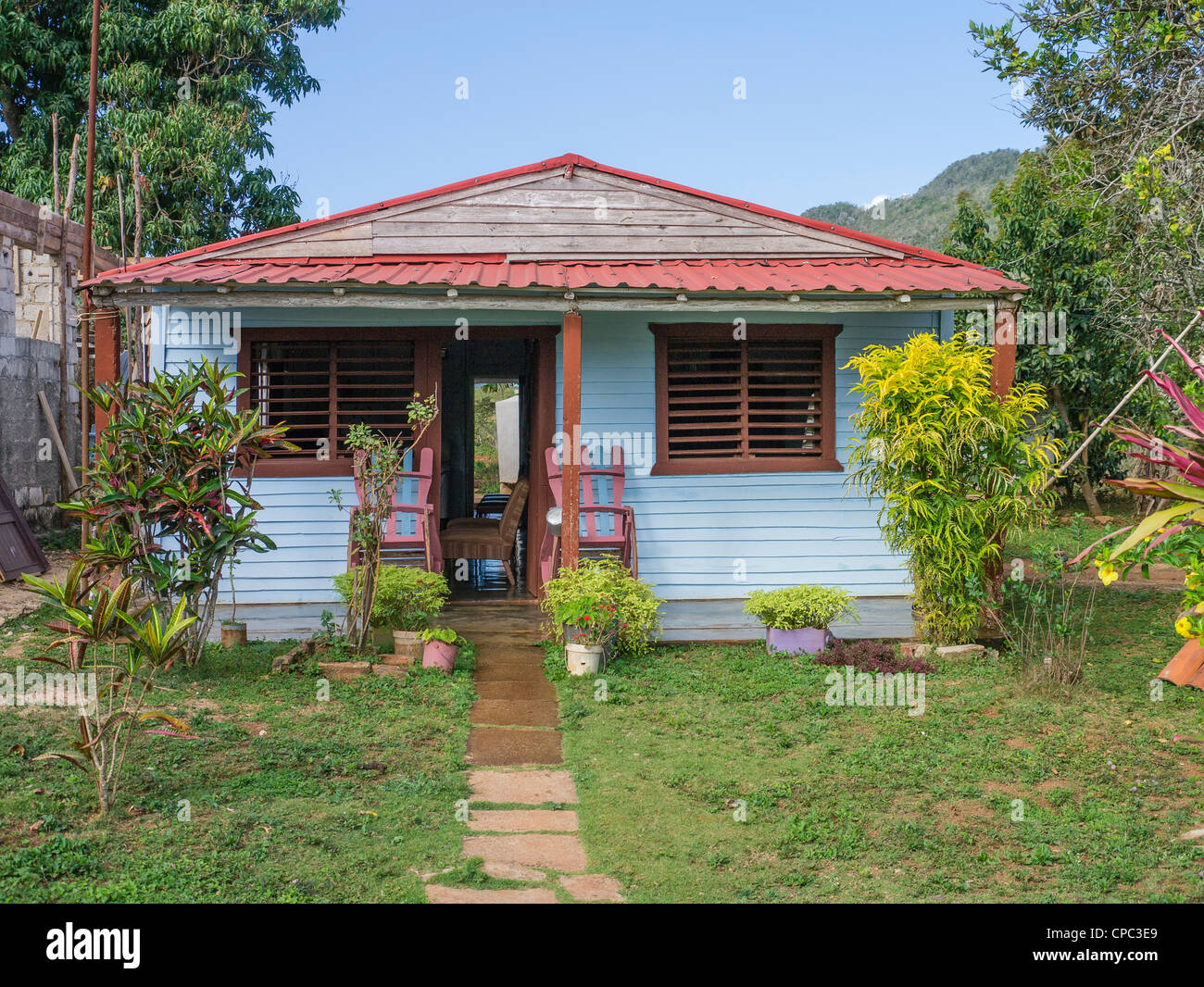The front of a typical small rural Cuban house as viewed from the street in Viñales, Cuba Stock The front of a typical small rural Cuban house as viewed from the street in Viñales, Cuba Stock