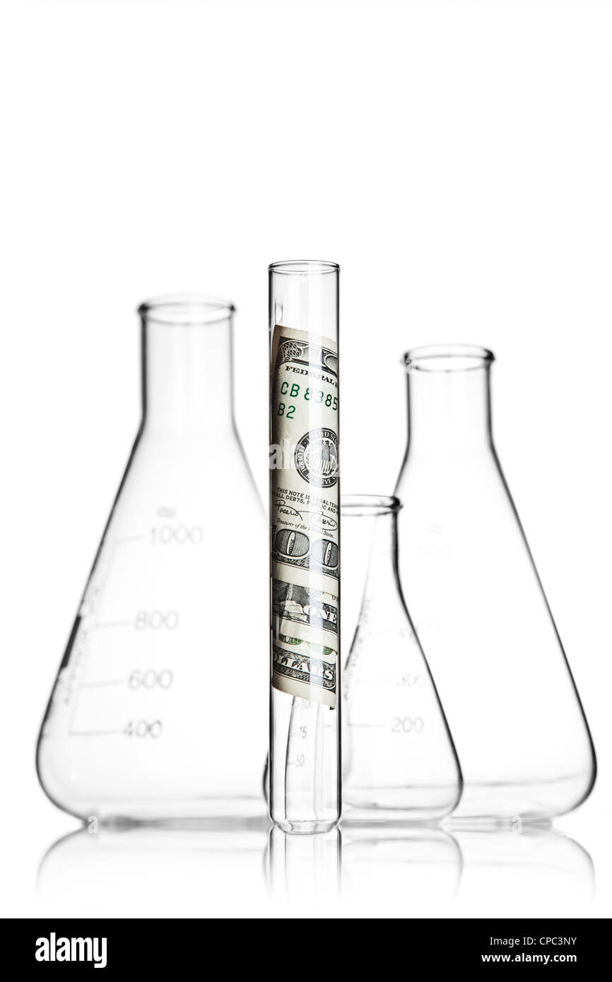 Test tube with 100 dollar bills and flasks Stock Photo Alamy