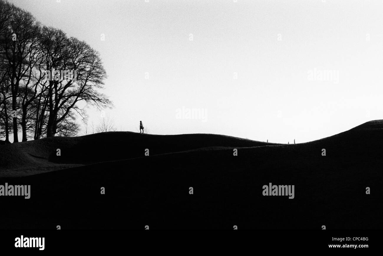 Avebury - figure walking along top of bank Stock Photo