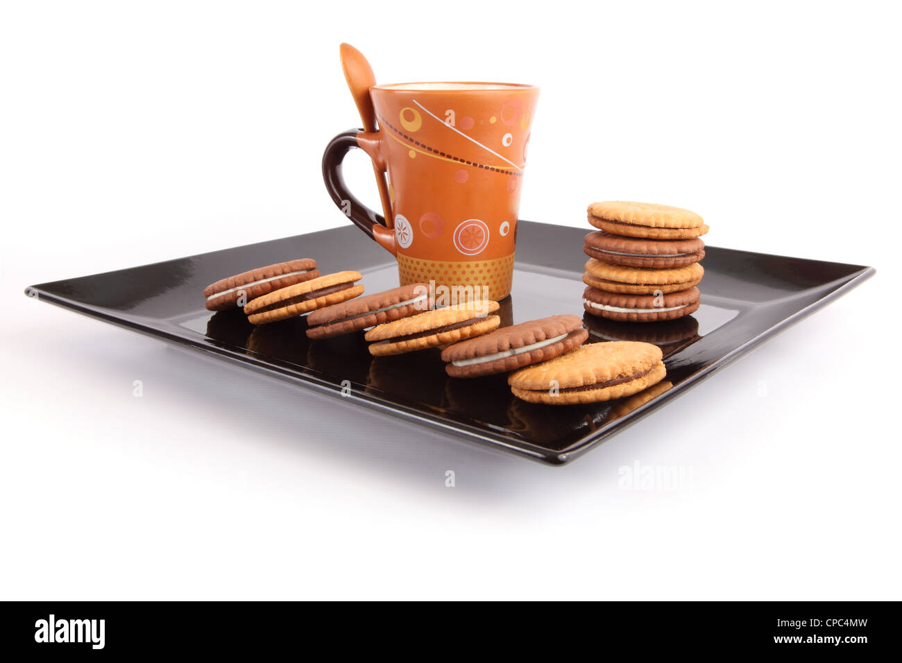 Cup of tea with biscuits on black Dish, breakfast Stock Photo