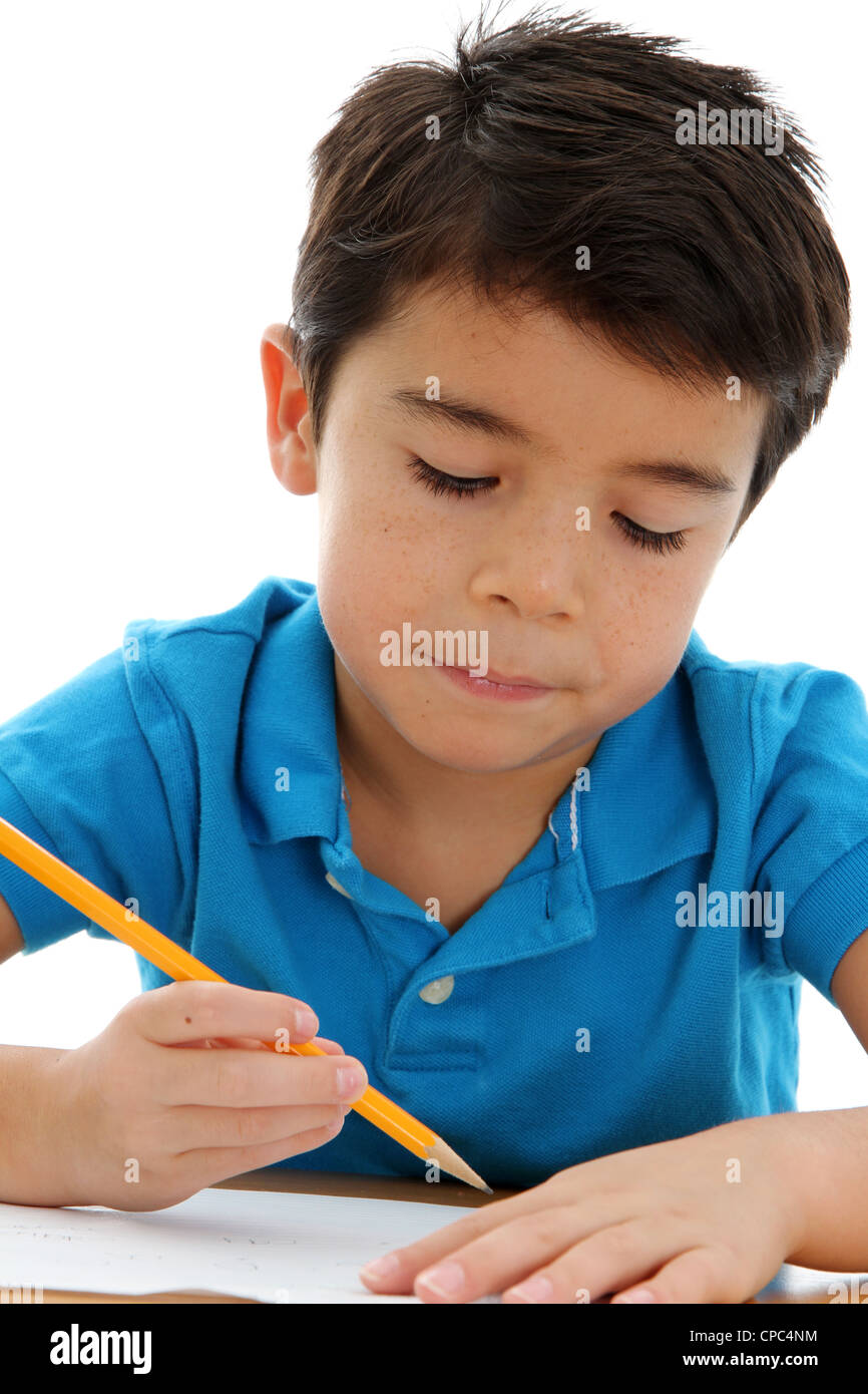 Boy writing on paper at his school Stock Photo - Alamy
