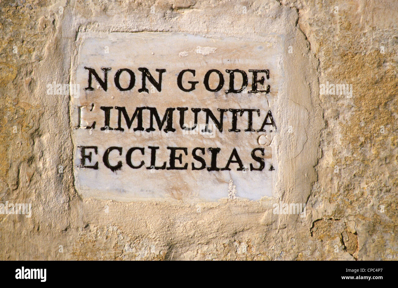 Malta.  Notice on a Church withdrawing the immunity from arrest formerly accorded criminals in flight sheltered inside. Stock Photo