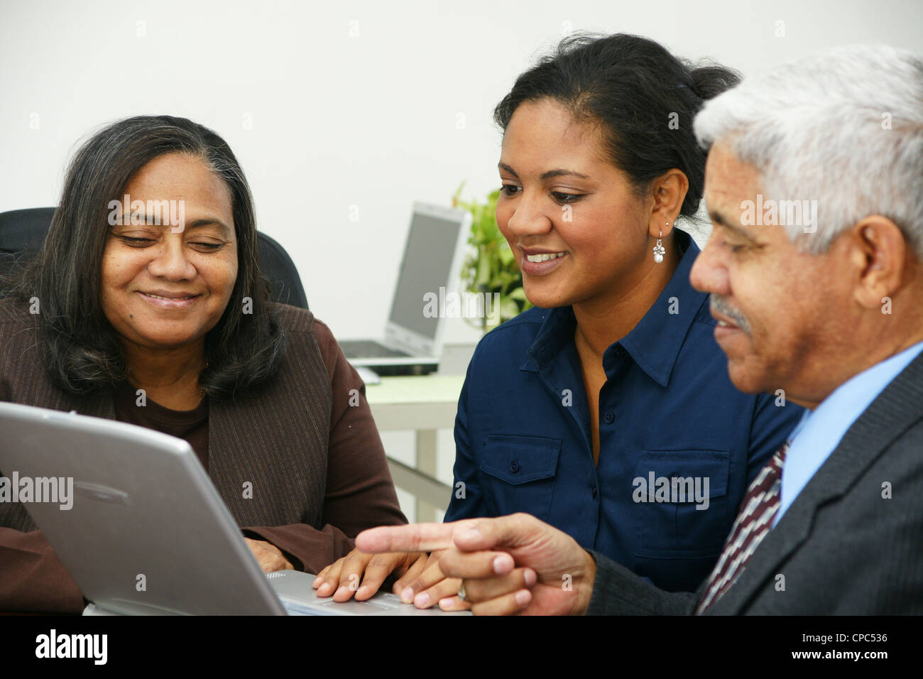 Team of business people working together in an office Stock Photo - Alamy