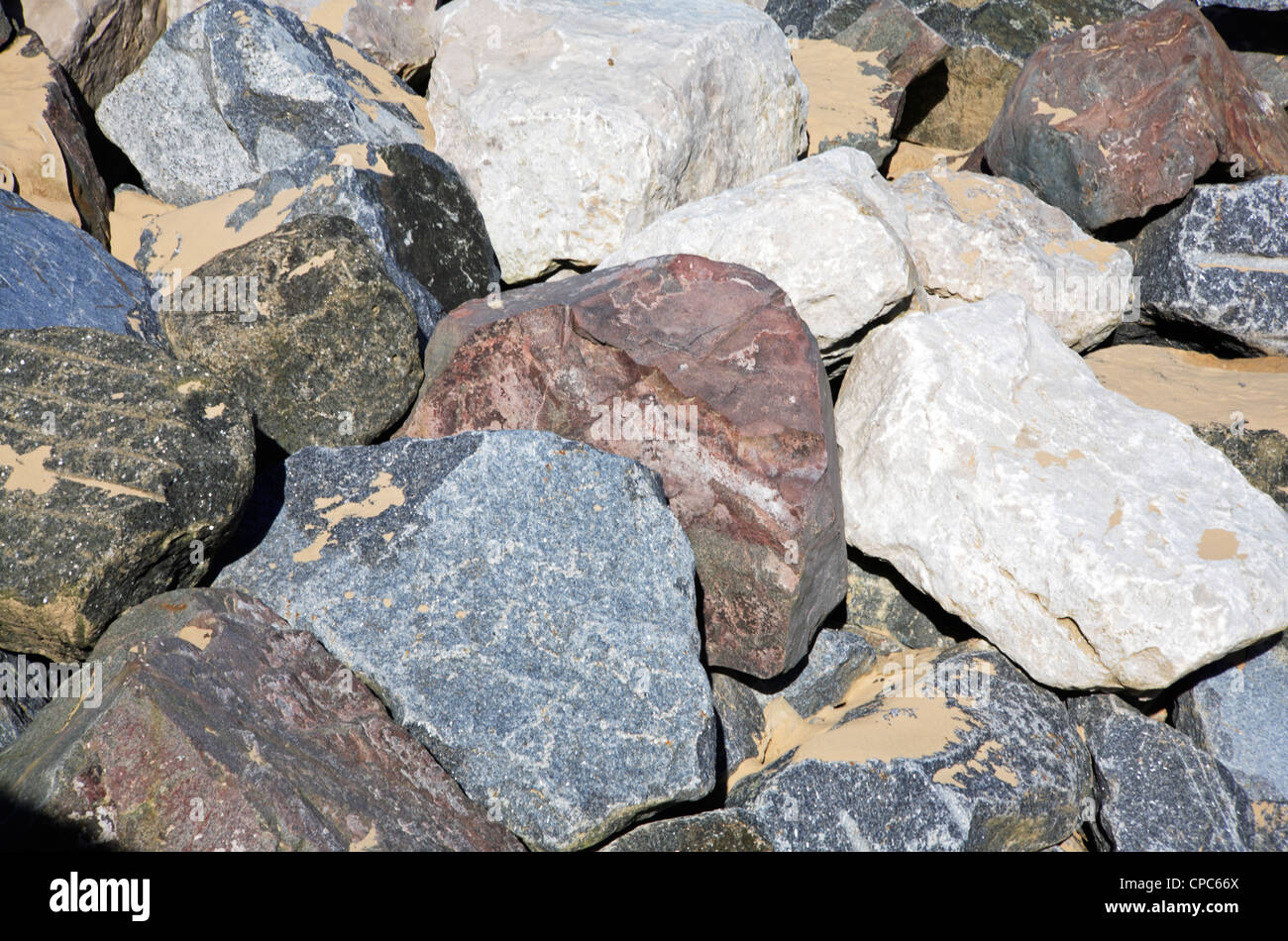 Various types of rock imported to build sea defences on the Norfolk ...