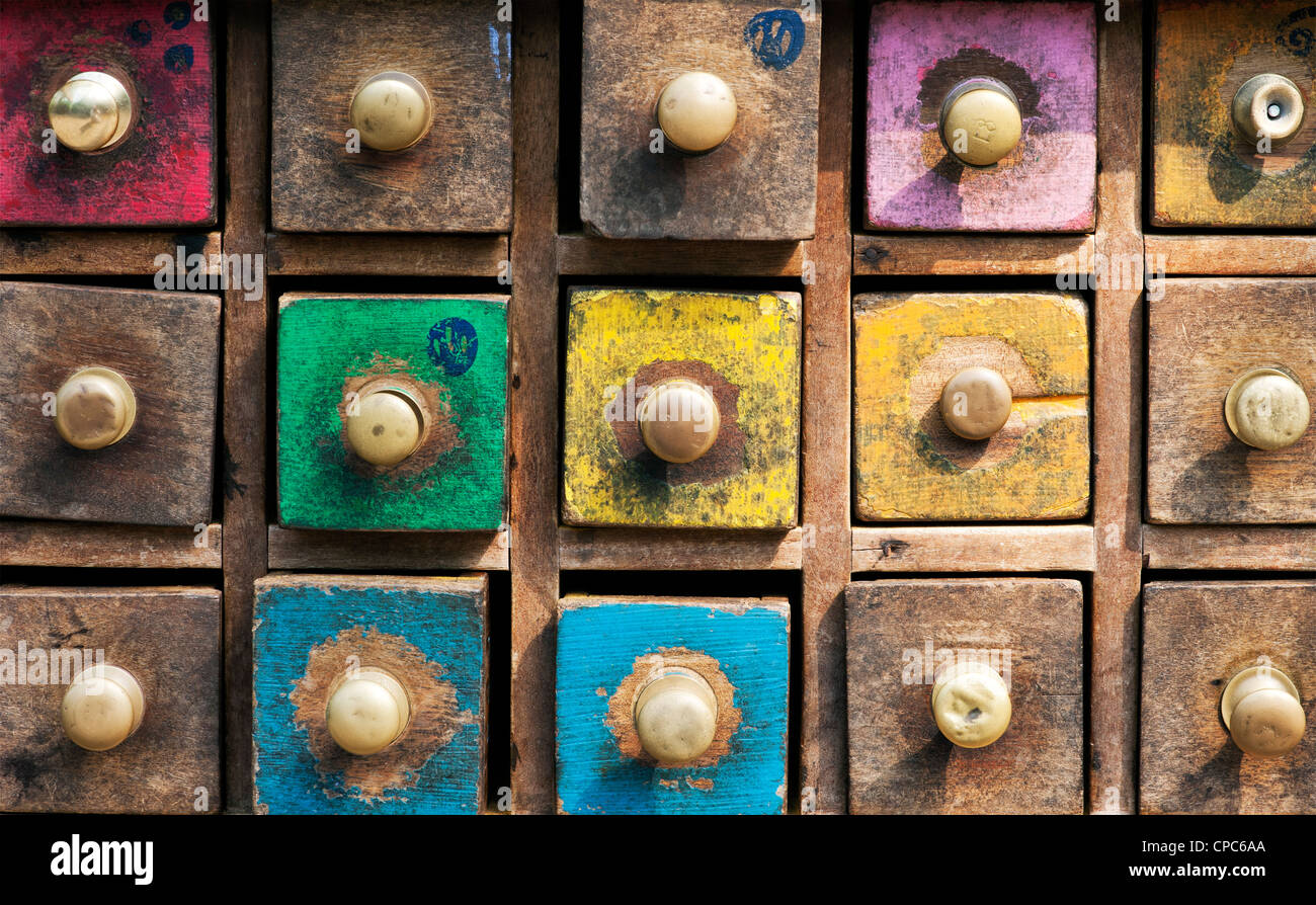 Colourful old wooden eastern spice cabinet drawers pattern Stock Photo