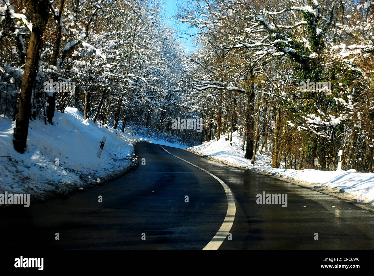 Snowy road in Winter Stock Photo