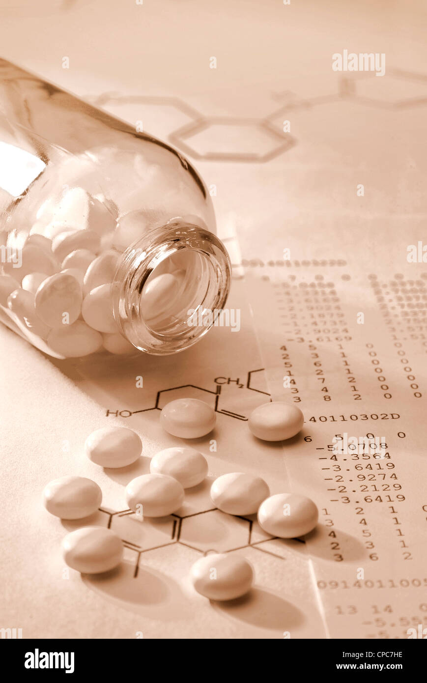 Tablets in a glass vial and structural formula. Stock Photo