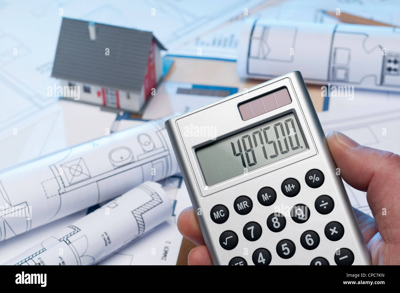Calculation of construction costs for a family home. Stock Photo