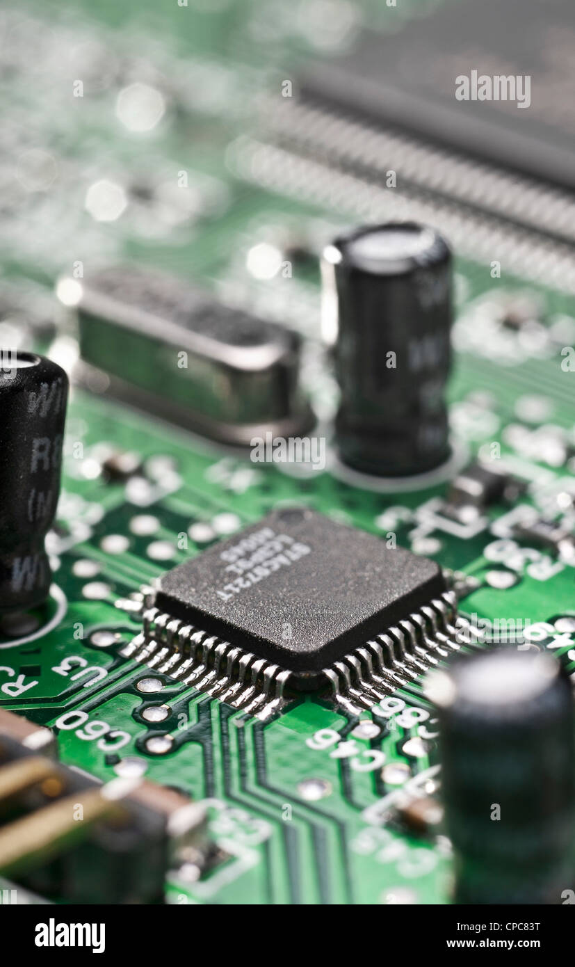 Detail of a computer circuit board with a focus on an integrated circuit. Stock Photo