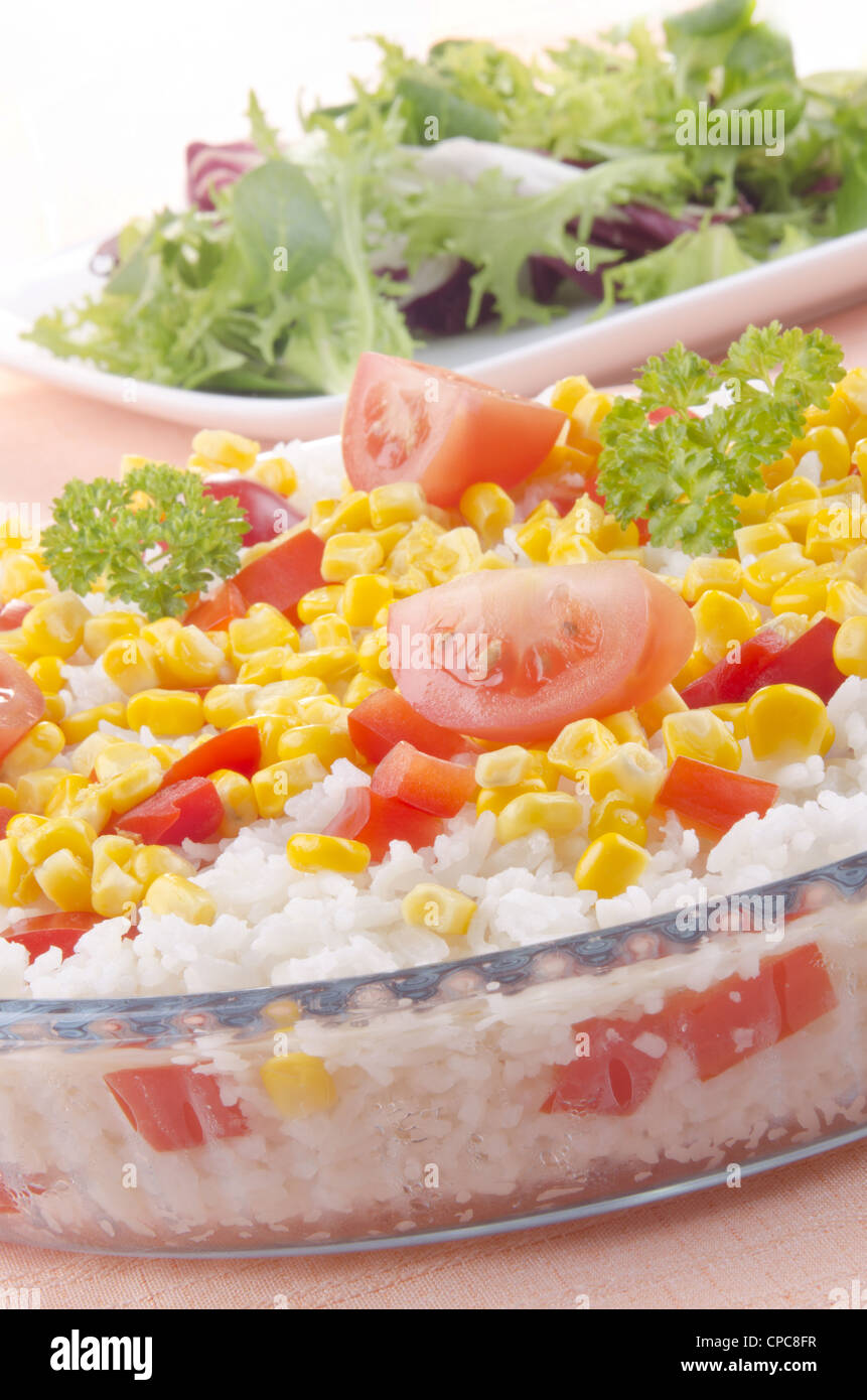organic rice in a bowl with diced peppers, sweet corn Stock Photo
