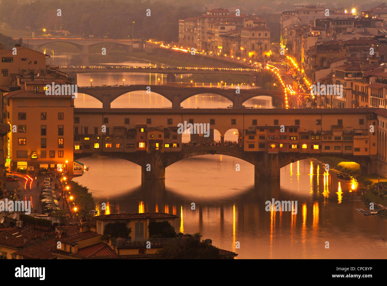 The Ponte Vecchio  reflected in the River Arno at night Florence Firenze Tuscany Italy EU Europe Stock Photo