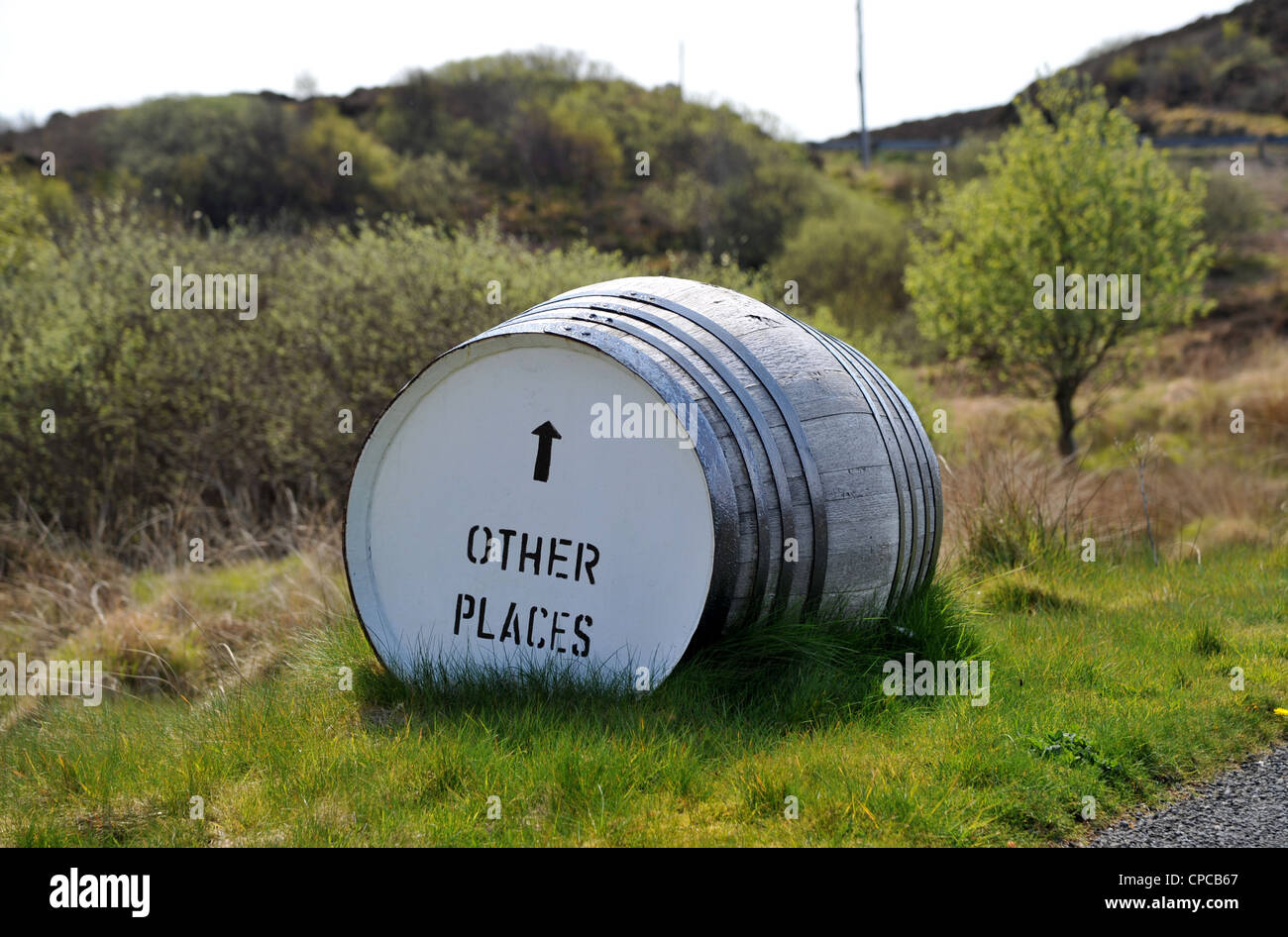 Whisky barrel signpost on the roadside 'Bunnahabhain Distillery 1/2 ...