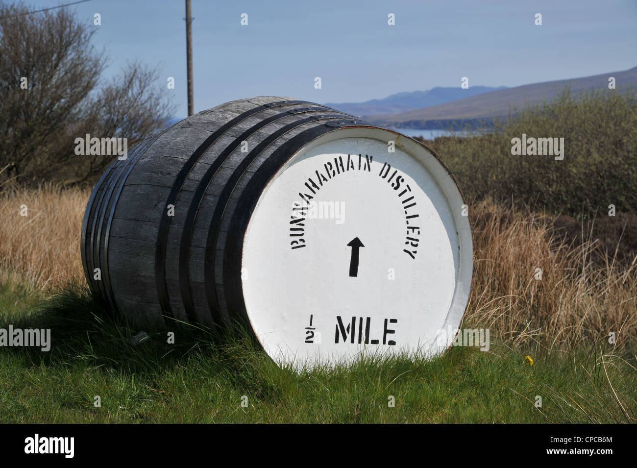 Whisky barrel signpost on the roadside 'Bunnahabhain Distillery 1/2 ...