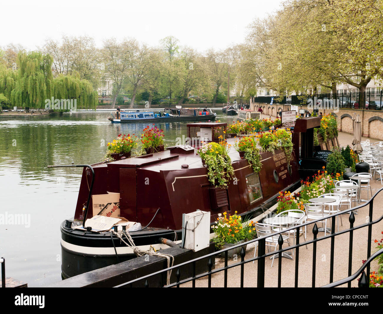 Cafe narrow boat in Little Venice, Paddington, West London, where the Grand Union Canal meets the Regent's Canal. Stock Photo