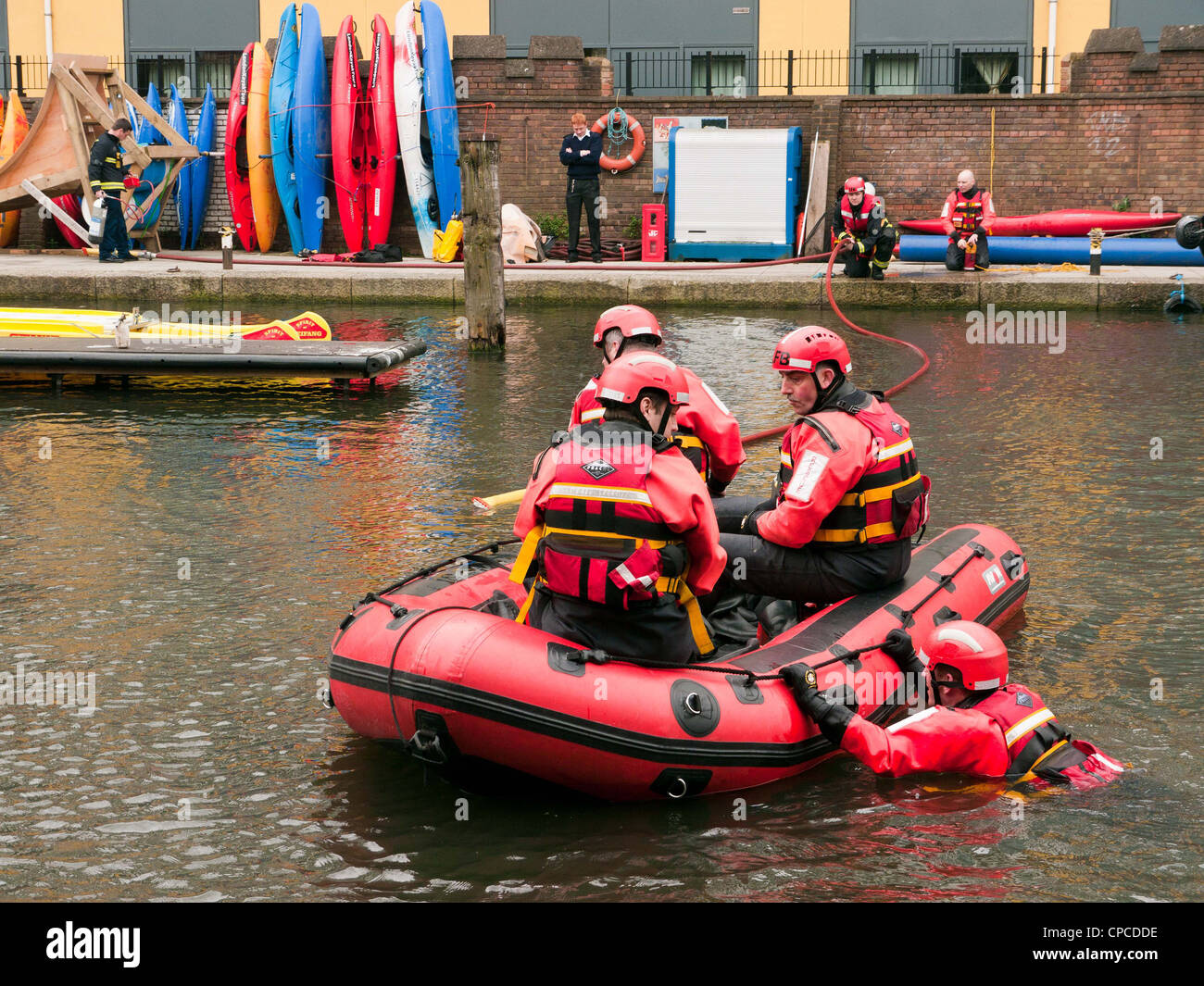 Men from the London Fire Brigade practicing on the canal in Little Venice, Paddington, West London, on the Grand Union Canal Stock Photo