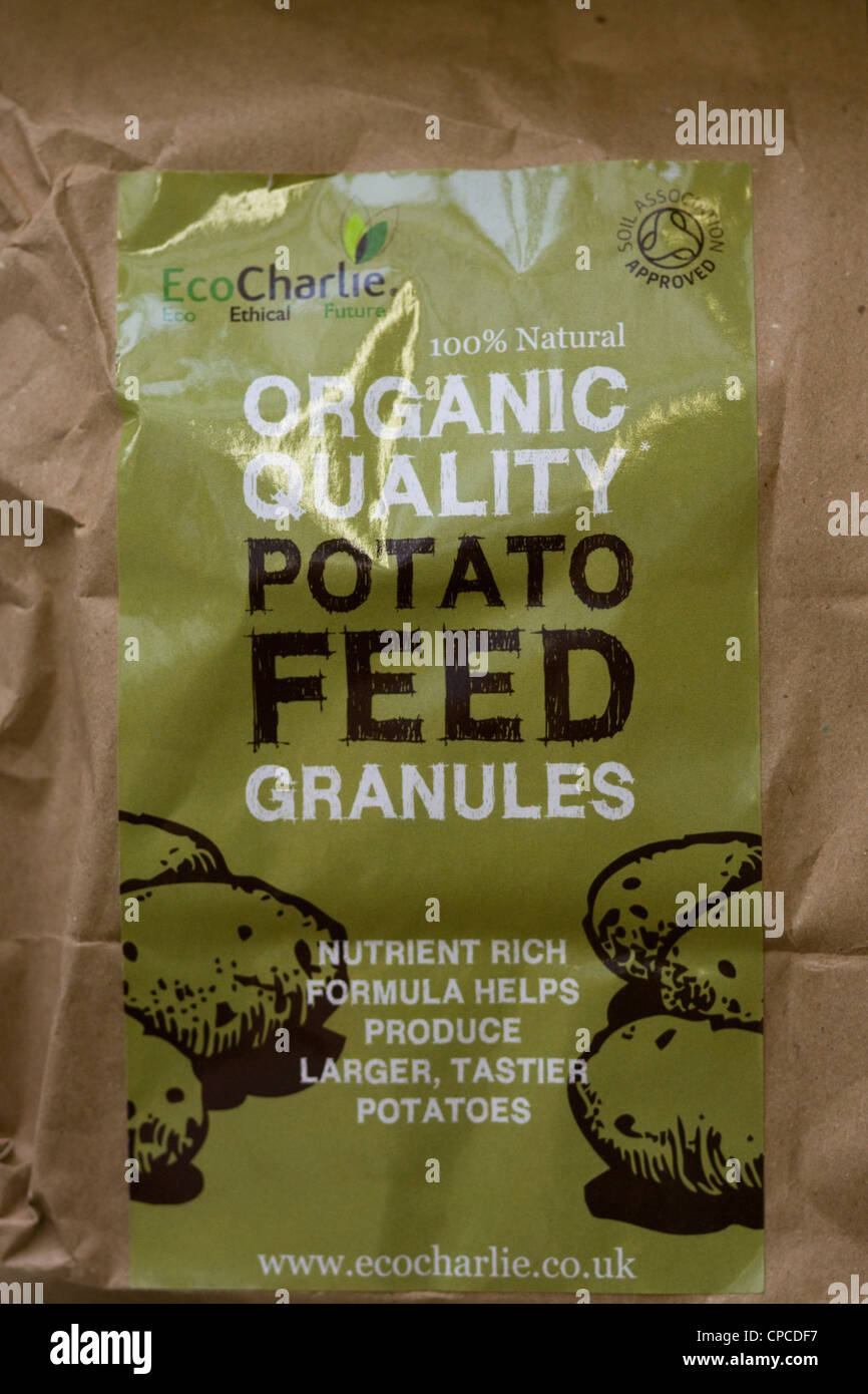 Organic Quality Granular Potato feed in brown bag Stock Photo
