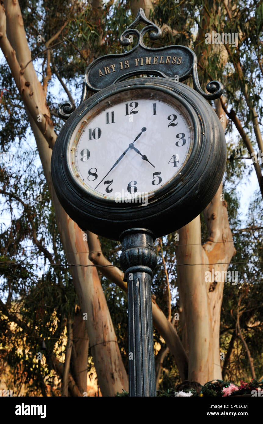 Venerable tall clock at the Sawdust Art Festival, Laguna Beach, California. The inscription says 'art is timeless' Stock Photo