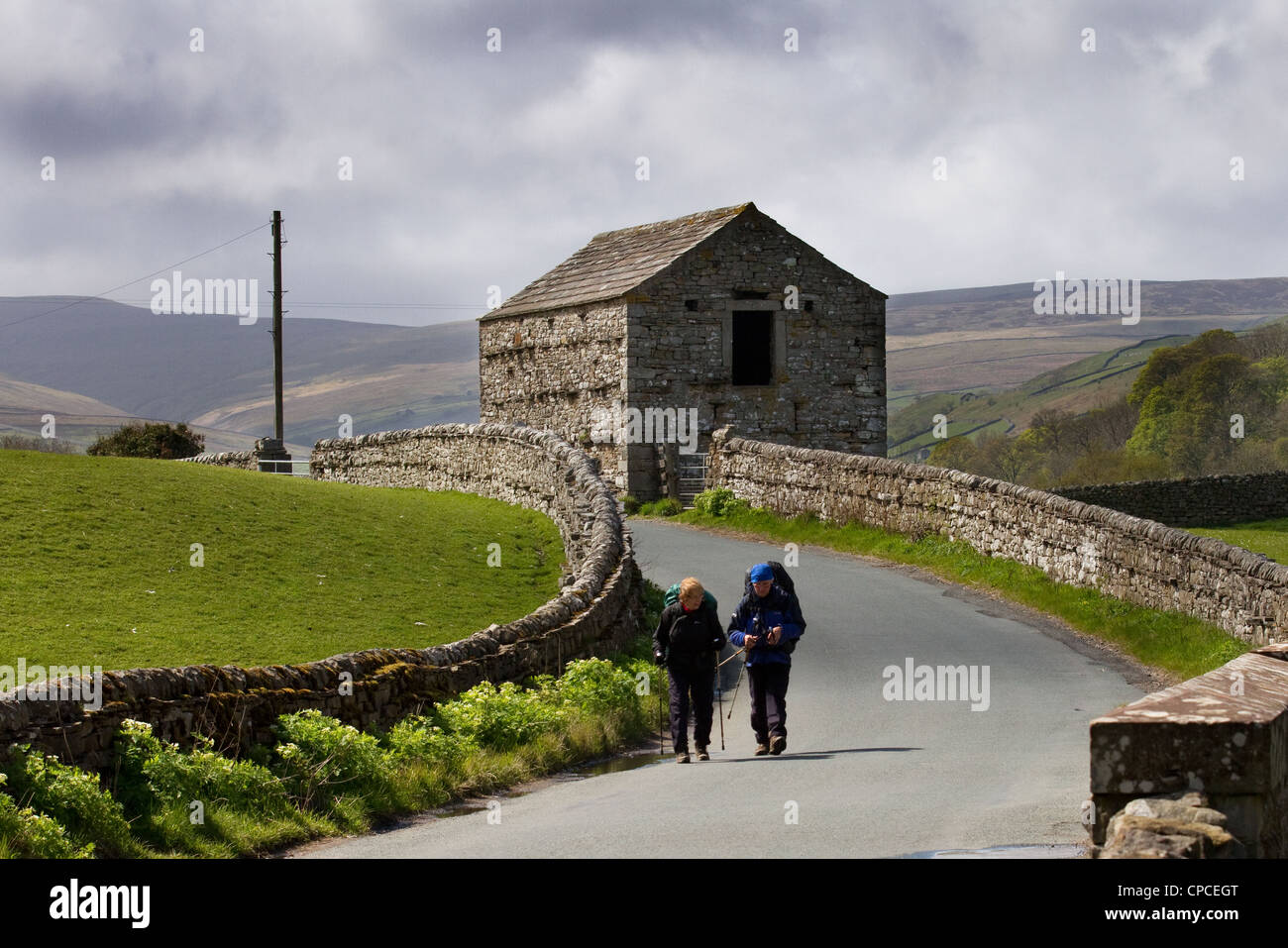 Coast to Coast walkersman & woman in Swaledale, 2012 on the route from Keld to Muker,  Richmondshire, North Dales Yorkshire National Park, Stock Photo