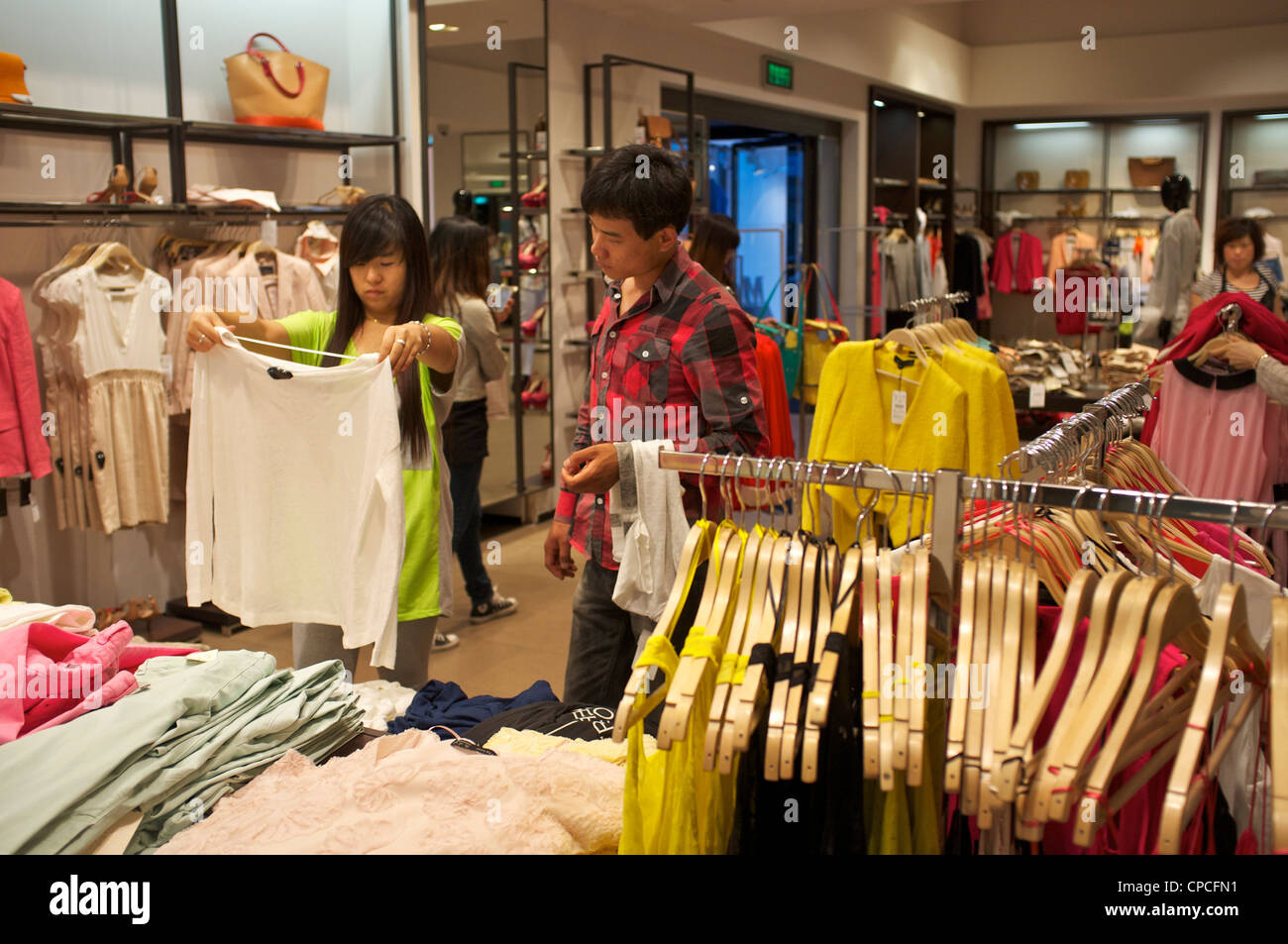 Chinese shopping at clothing retailer ZARA store in Tianjin, China. 14-May-2012 Stock Photo