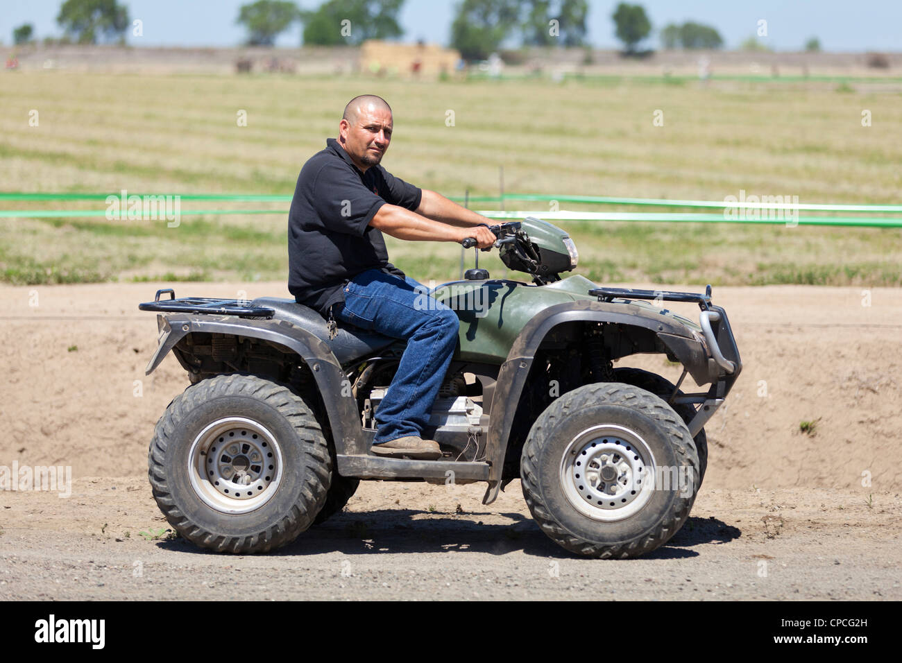 A man riding an ATV Stock Photo Alamy