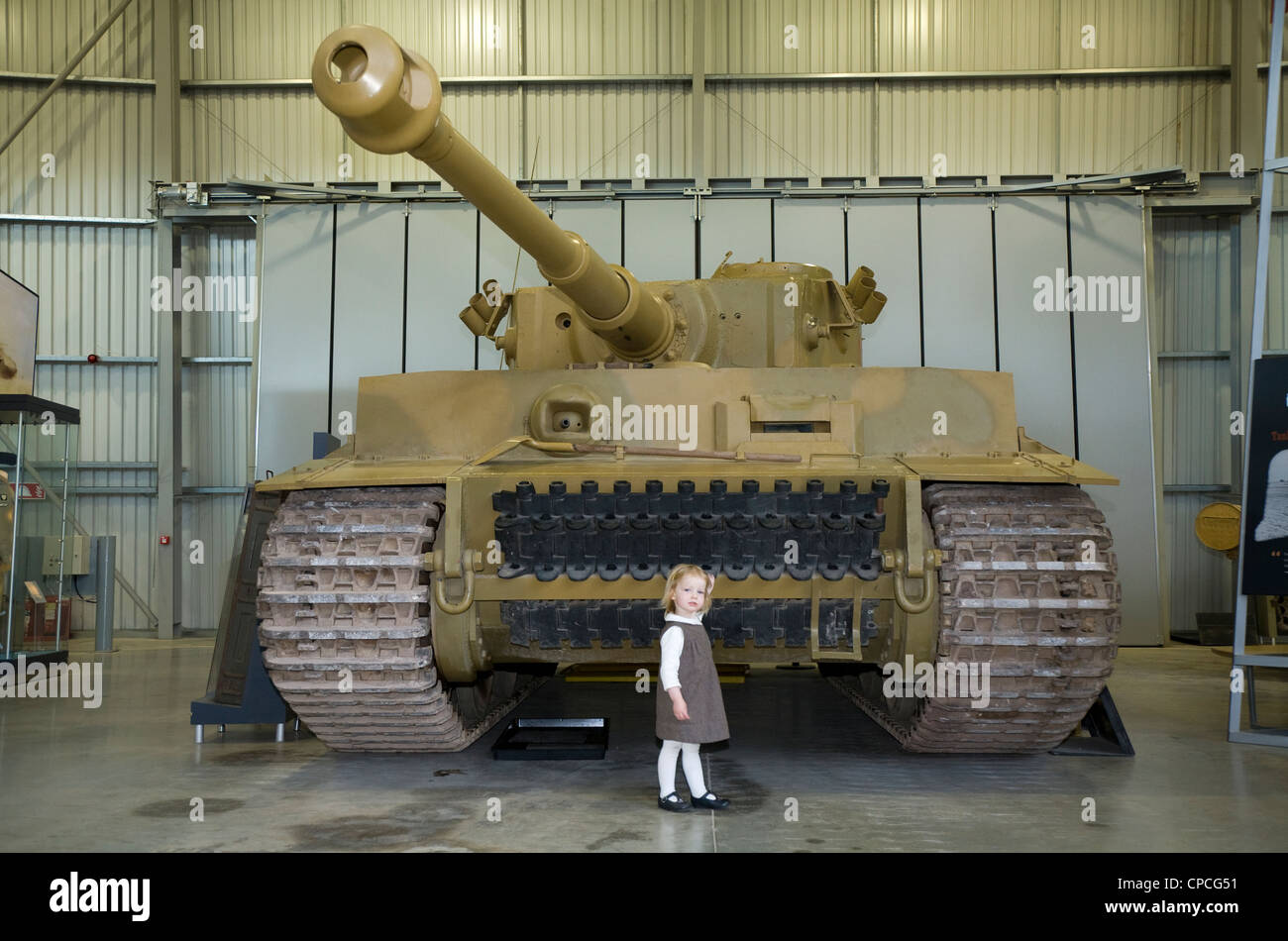 German Second World War / WW2 / WWII Tiger Tank (and tourist / young child to give scale). The Tank Museum, Bovington, Dorset UK Stock Photo