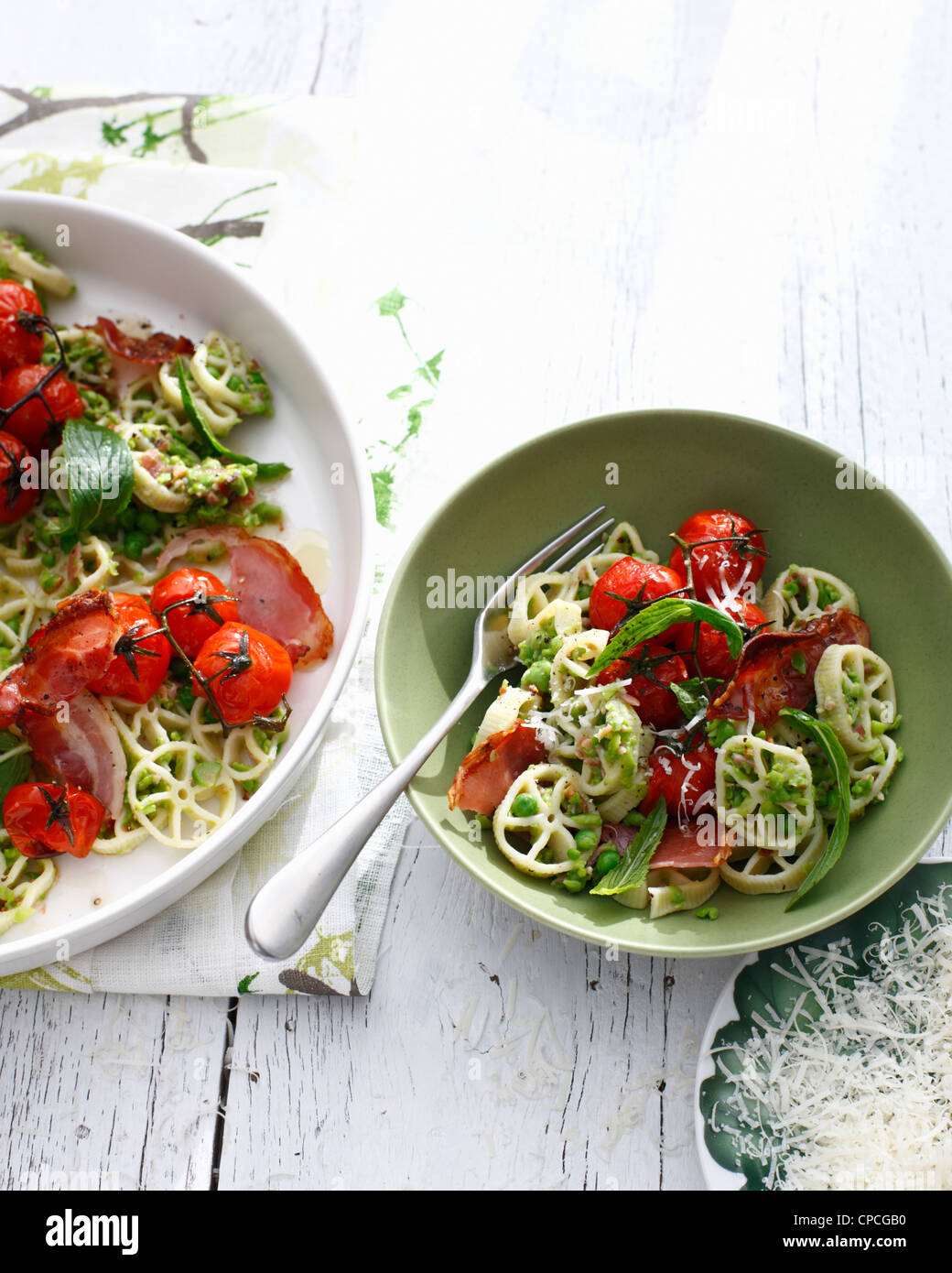 Bowls of tomato and herb pasta Stock Photo