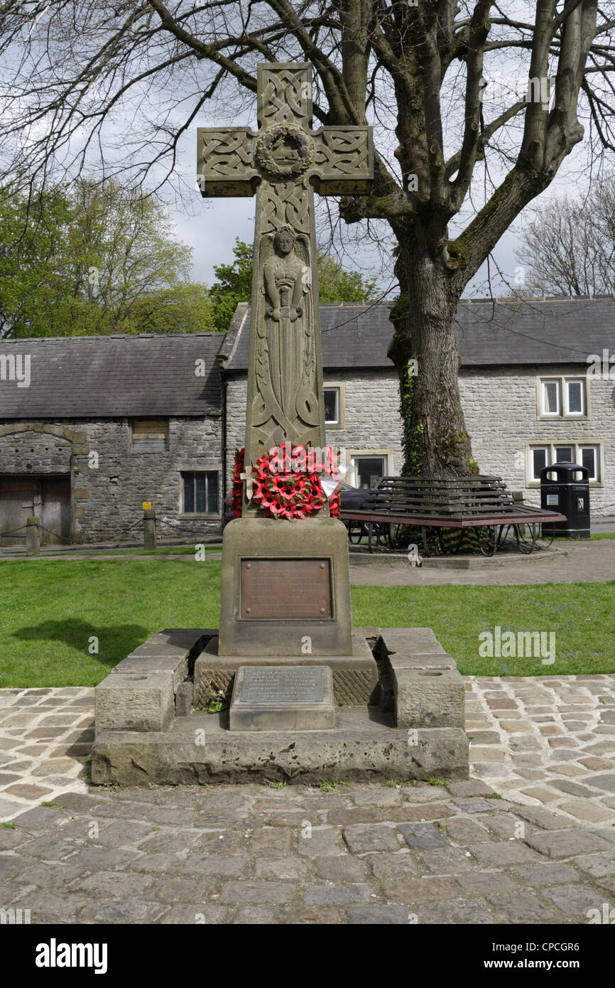 A war memorial in the village square at Castleton in Derbyshire England ...