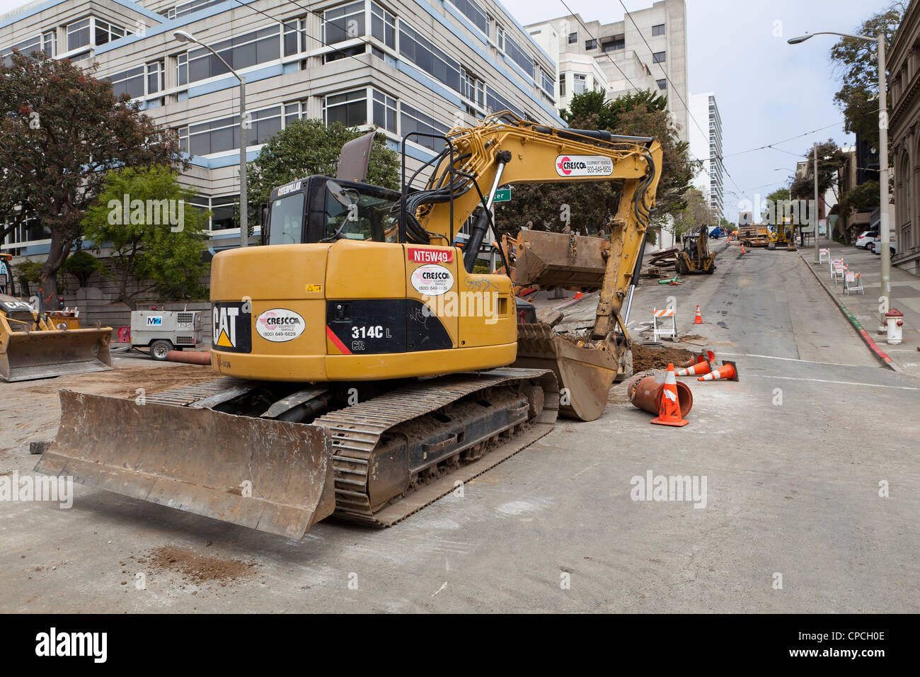 A Caterpillar 314C LCR tracked hydraulic excavator used in urban construction site Stock Photo