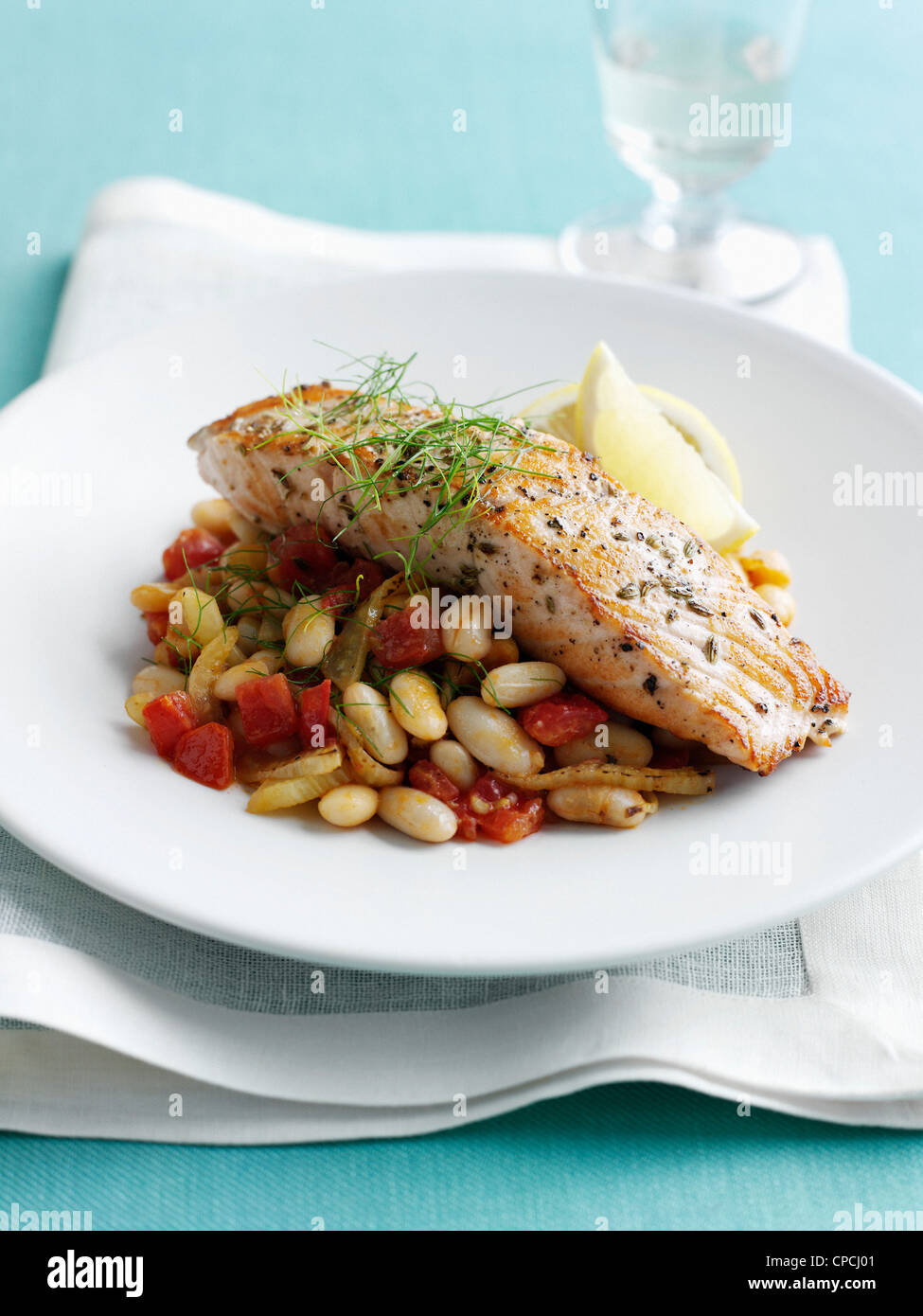 Plate of fish with beans and tomatoes Stock Photo Alamy