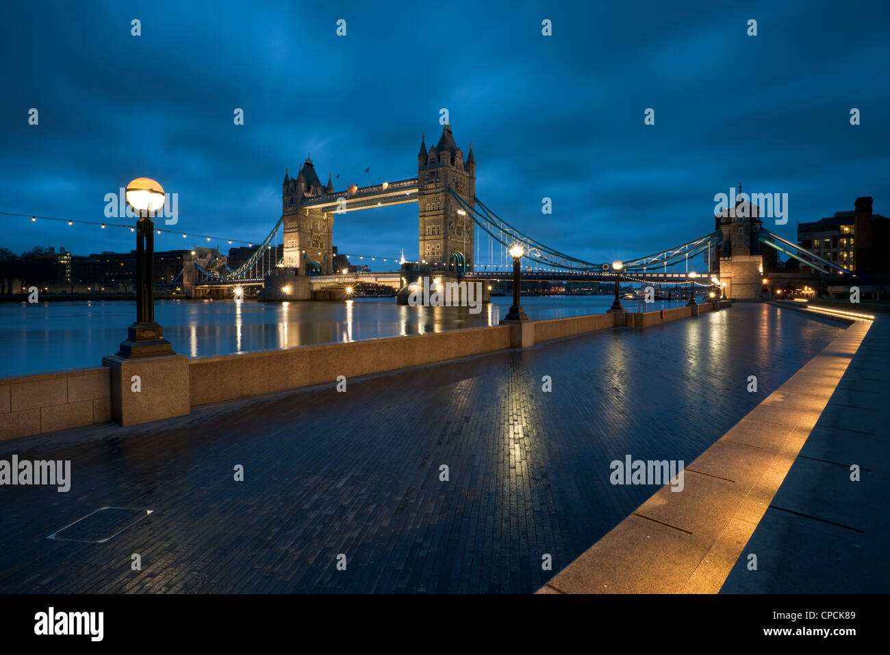 Tower Bridge seen from Queen's Walk at night, London. Stock Photo