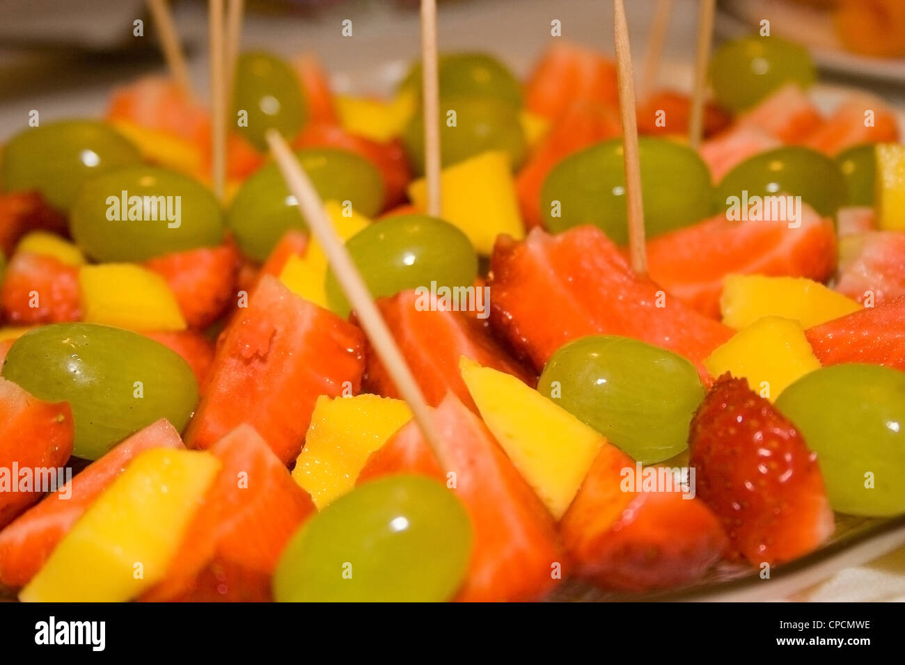 A close up of Strawberrys and Mango in a dish Stock Photo