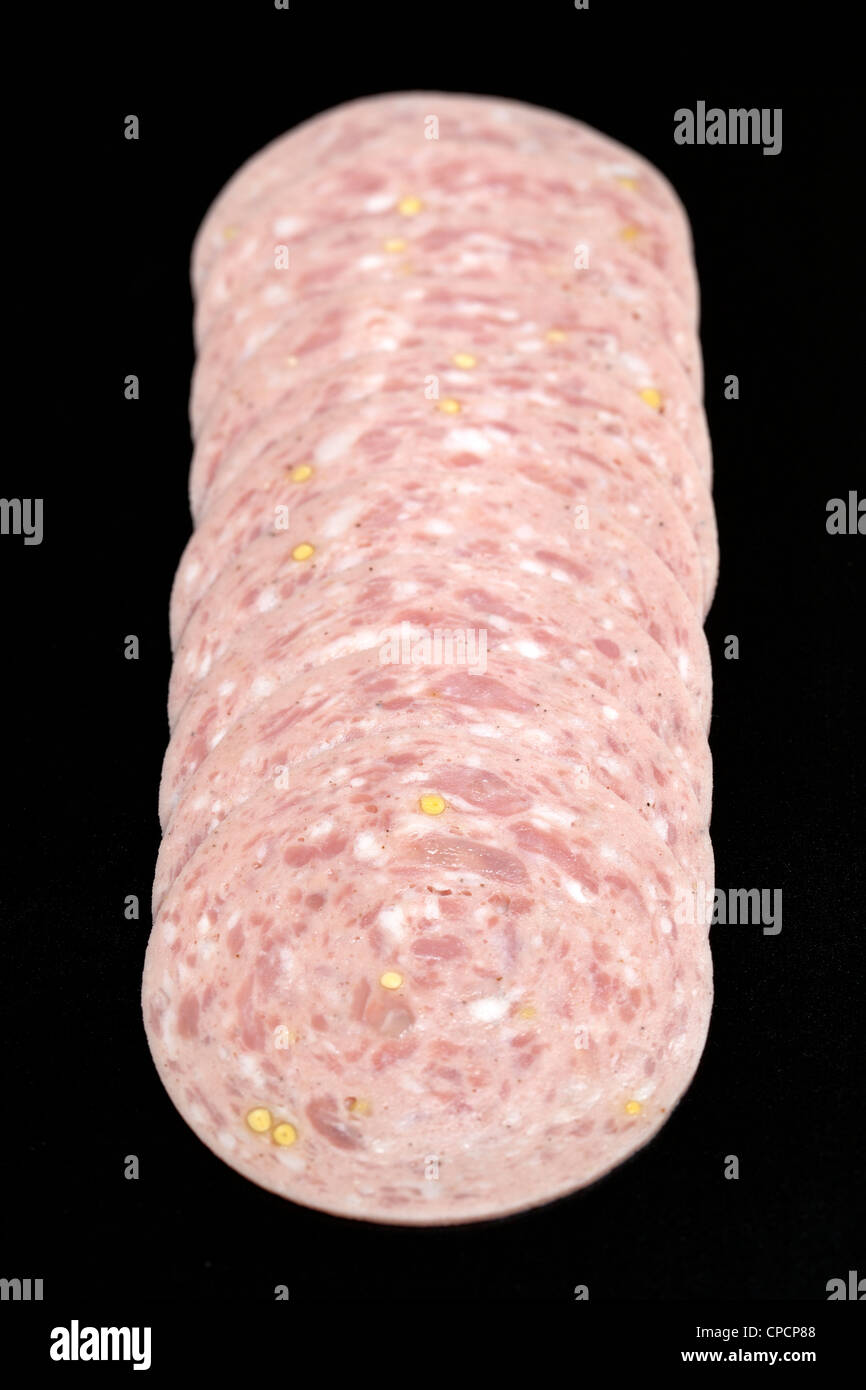 Slices of German Sausage Meat on black background Stock Photo Alamy
