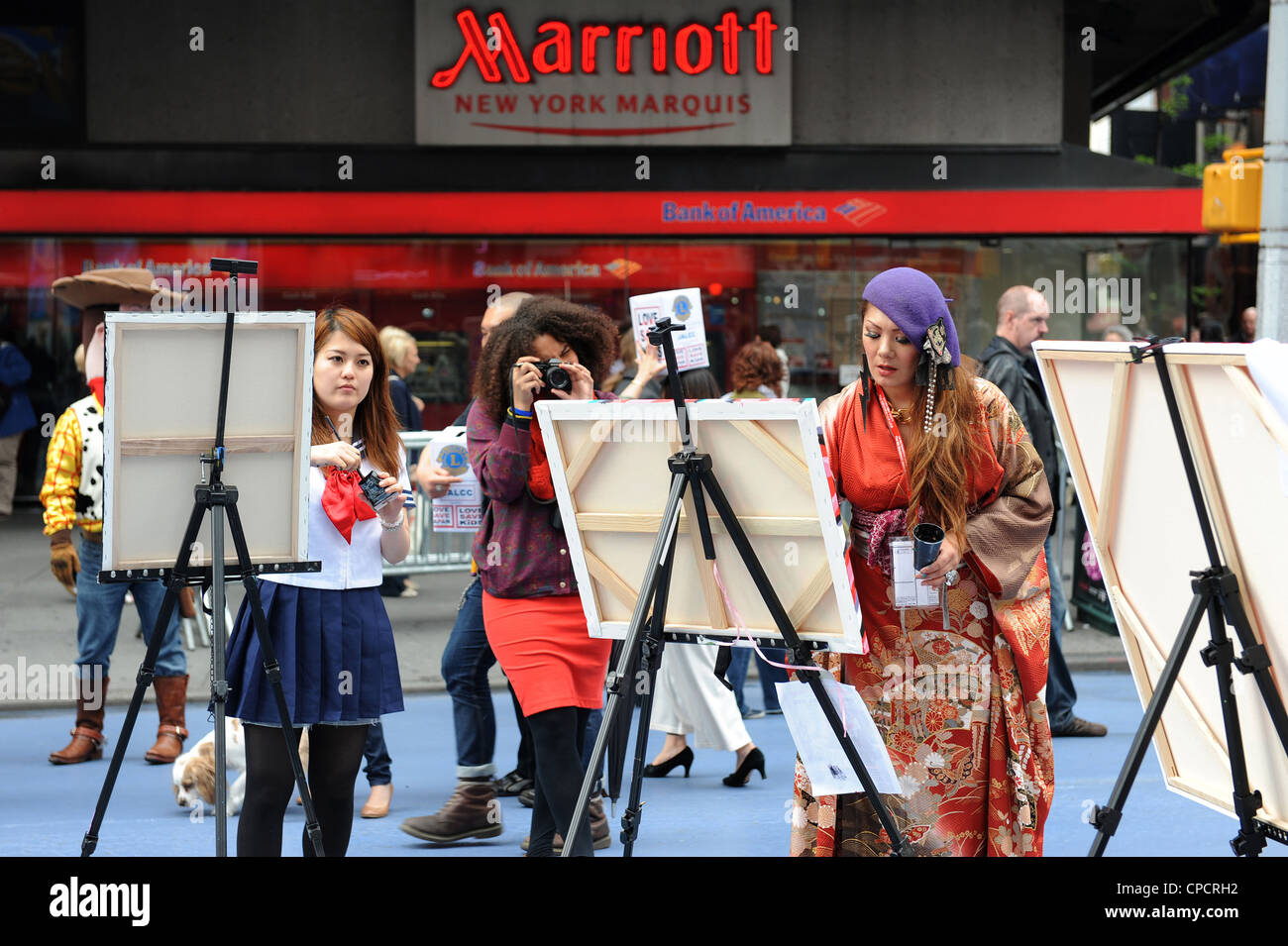 Artists painting in Times Square raising money for Japanese American Lions Club Charities Stock Photo