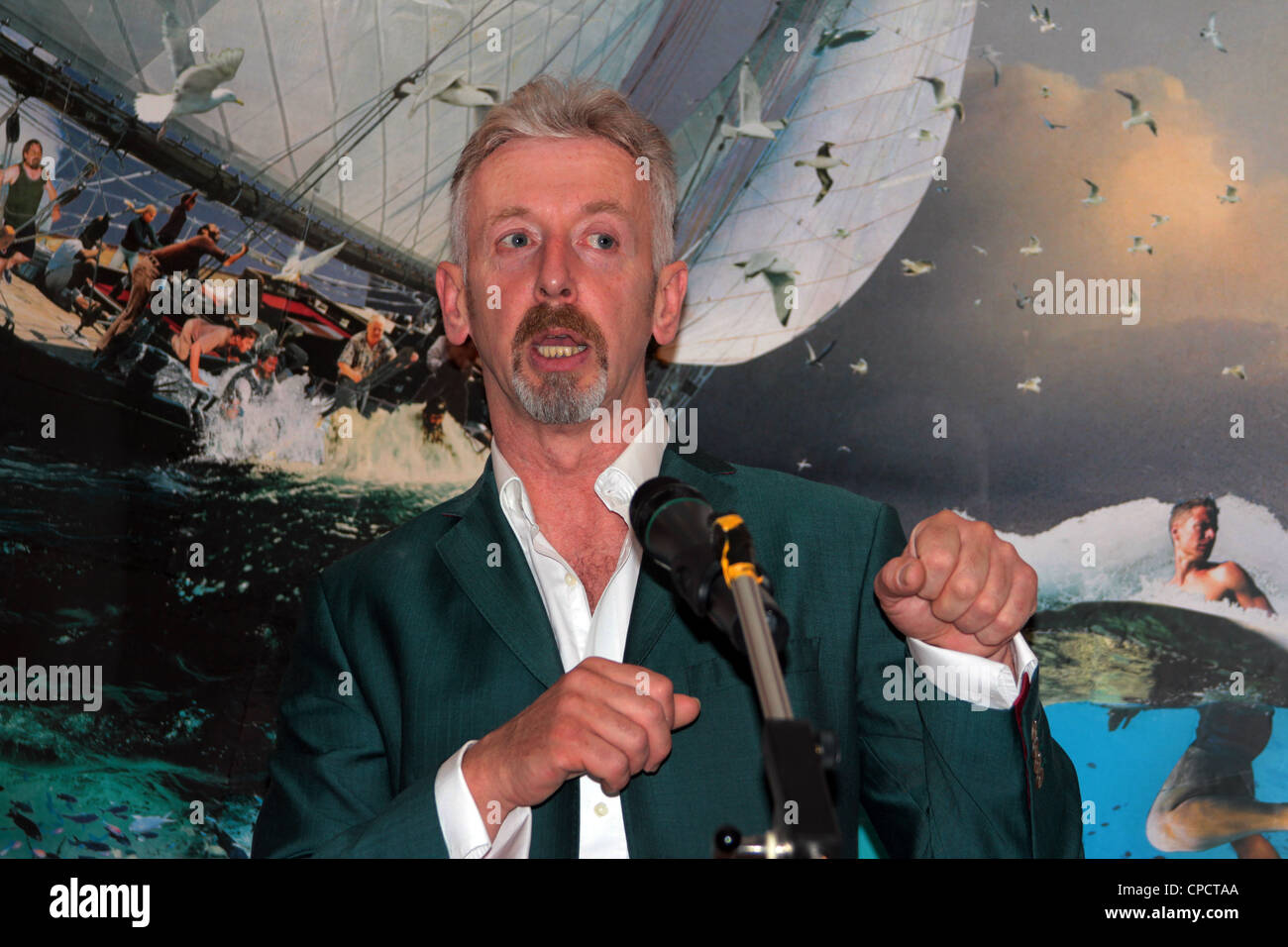 The Scottish artist David Mach and one of his collage pieces at an exhibition in Edinburgh in 2011 Stock Photo