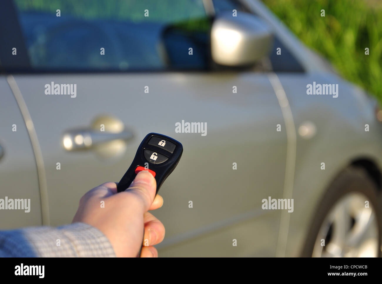 A hand holding car keys Stock Photo