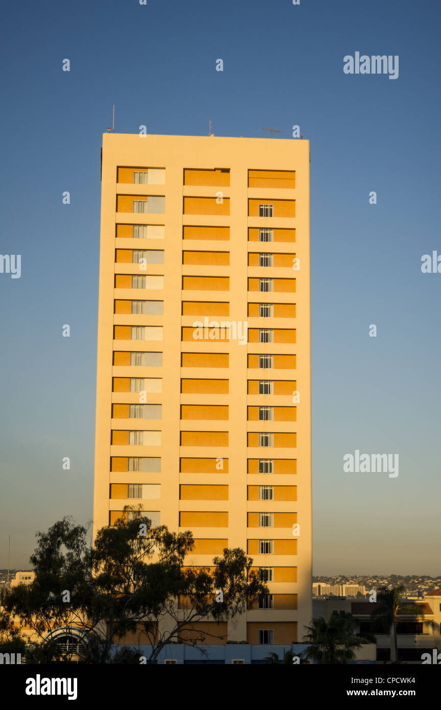 Sunrise turns an apartment building golden Stock Photo Alamy