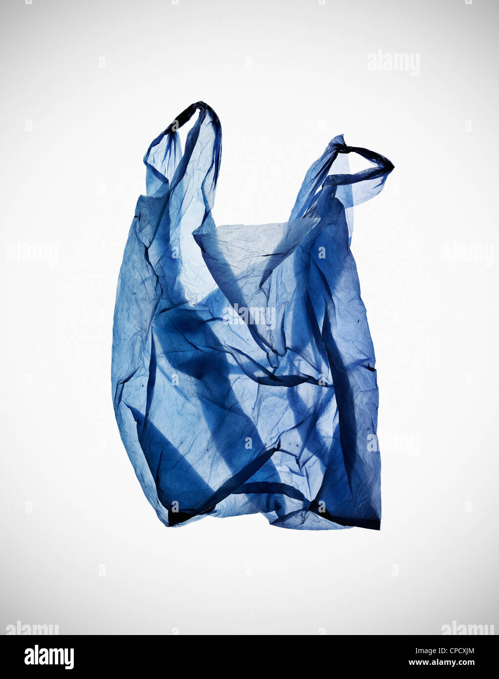 Crumpled blue plastic bag on table Stock Photo