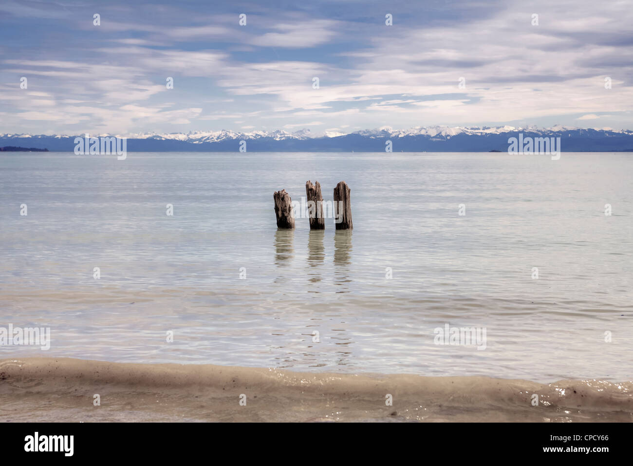 three broken wood piles in Lake Constance, view of the Santis Stock Photo