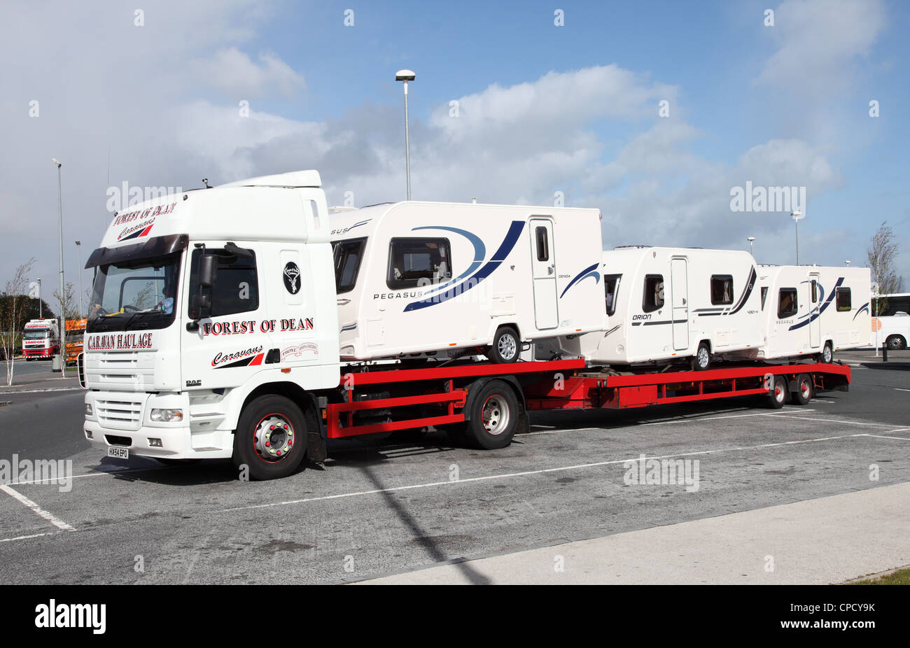 A DAF truck  and trailer, owned by Forest of Dean caravans, carrying three new caravans. Stock Photo