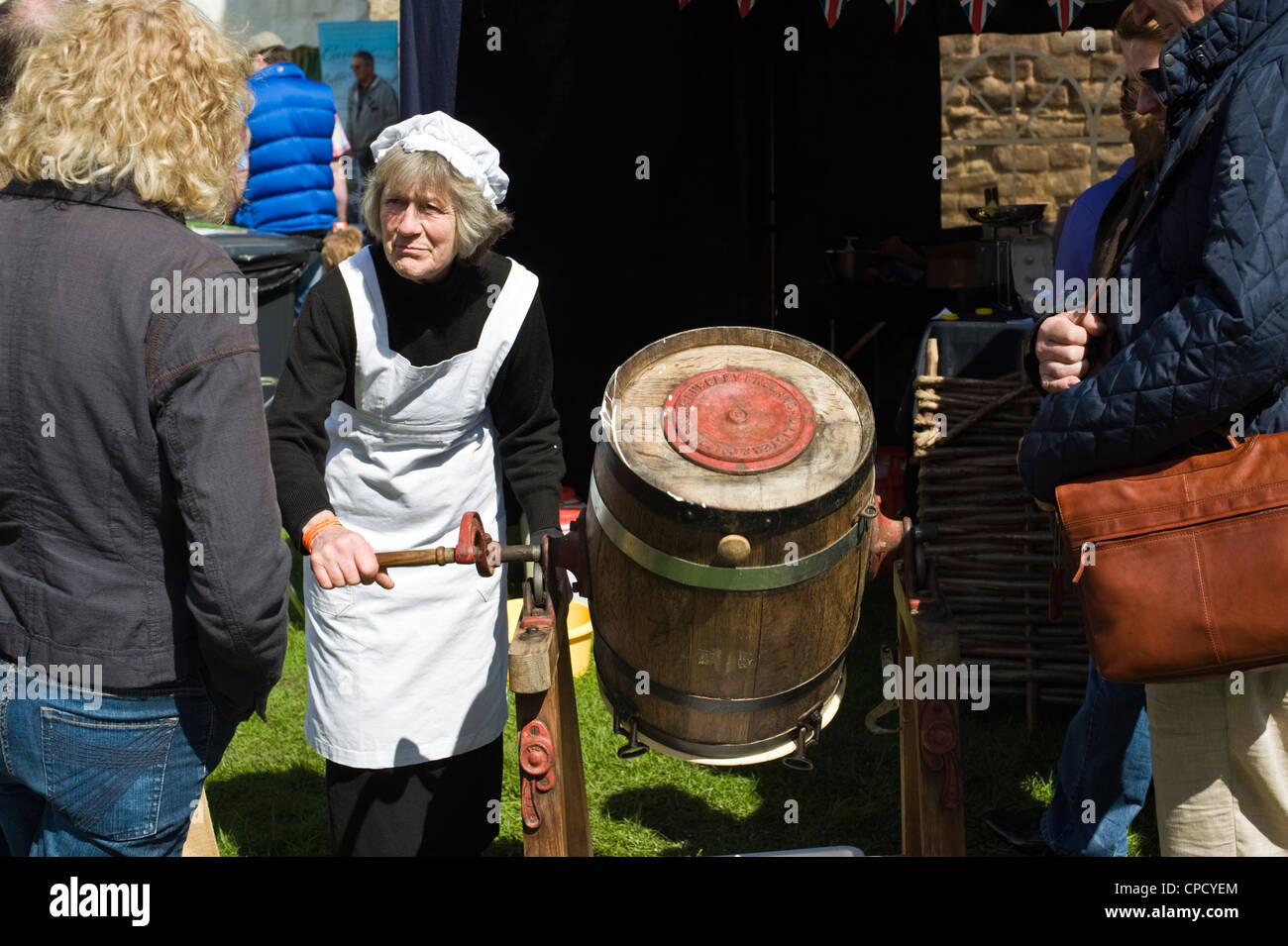 Woman churning butter hires stock photography and images Alamy