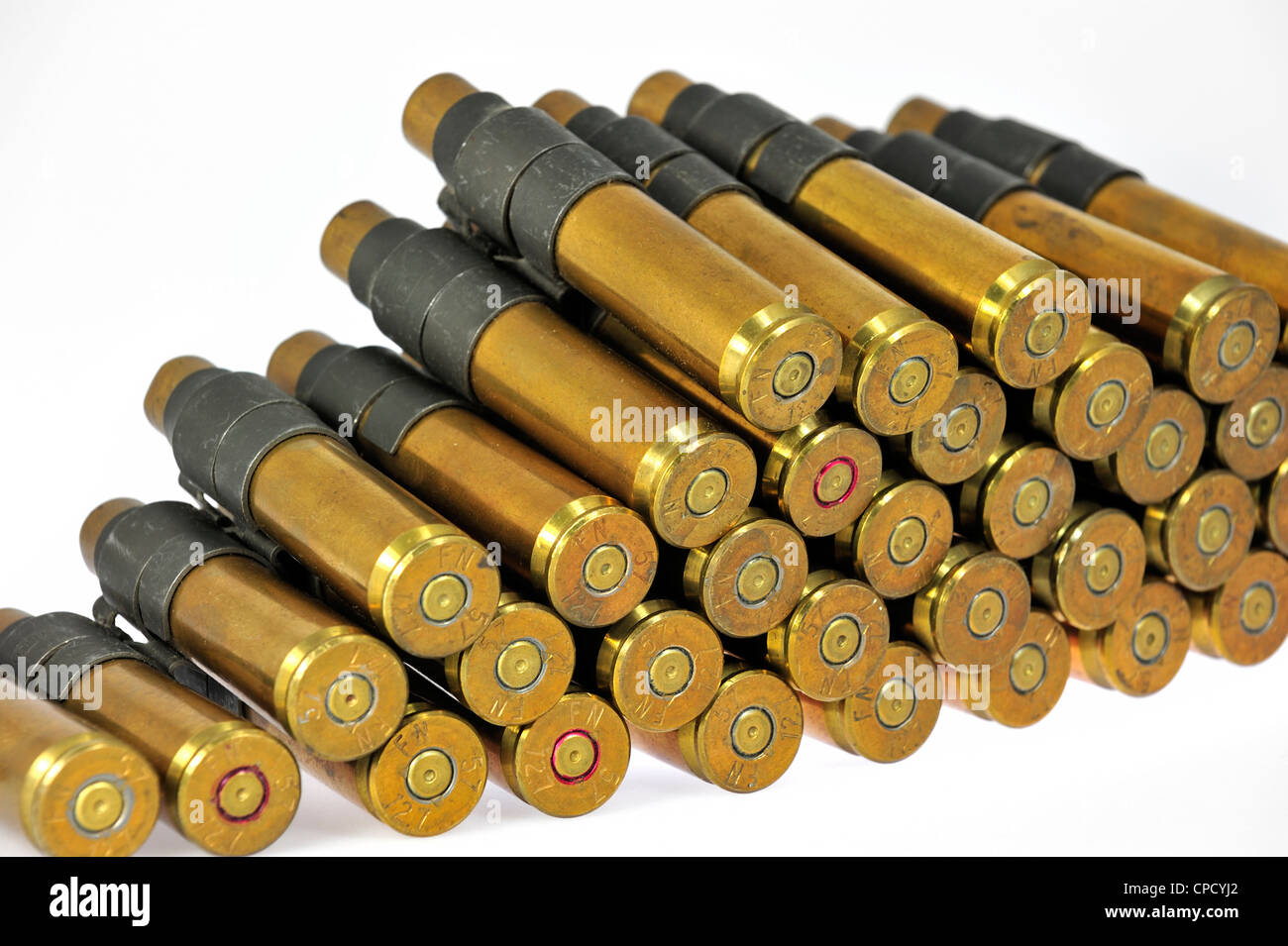 M2 Browning .50 caliber machine gun cartridges in ammunition belt made by FN Herstal weapon factory in Belgium Stock Photo
