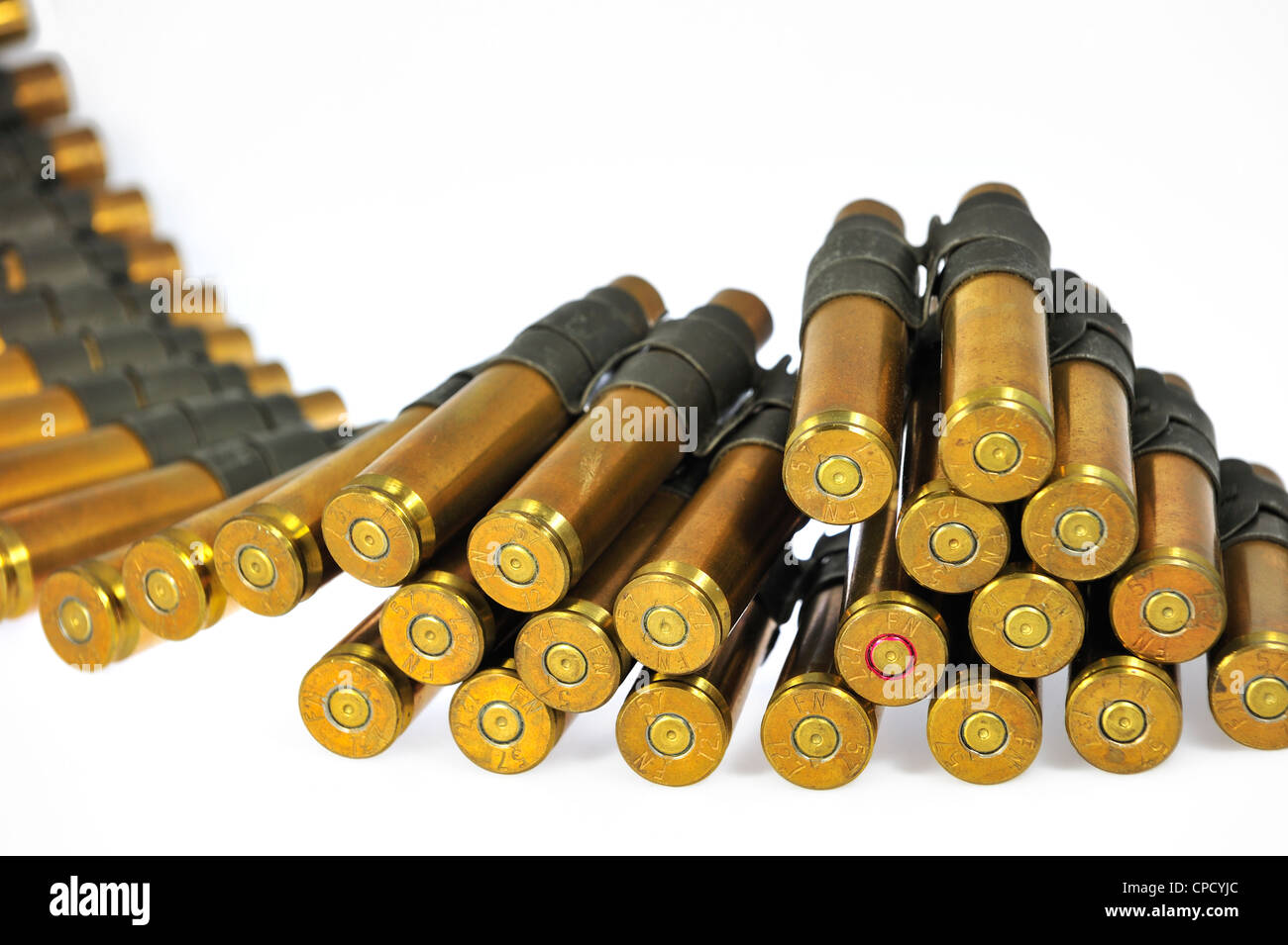 M2 Browning .50 caliber machine gun cartridges in ammunition belt made by FN Herstal weapon factory in Belgium Stock Photo