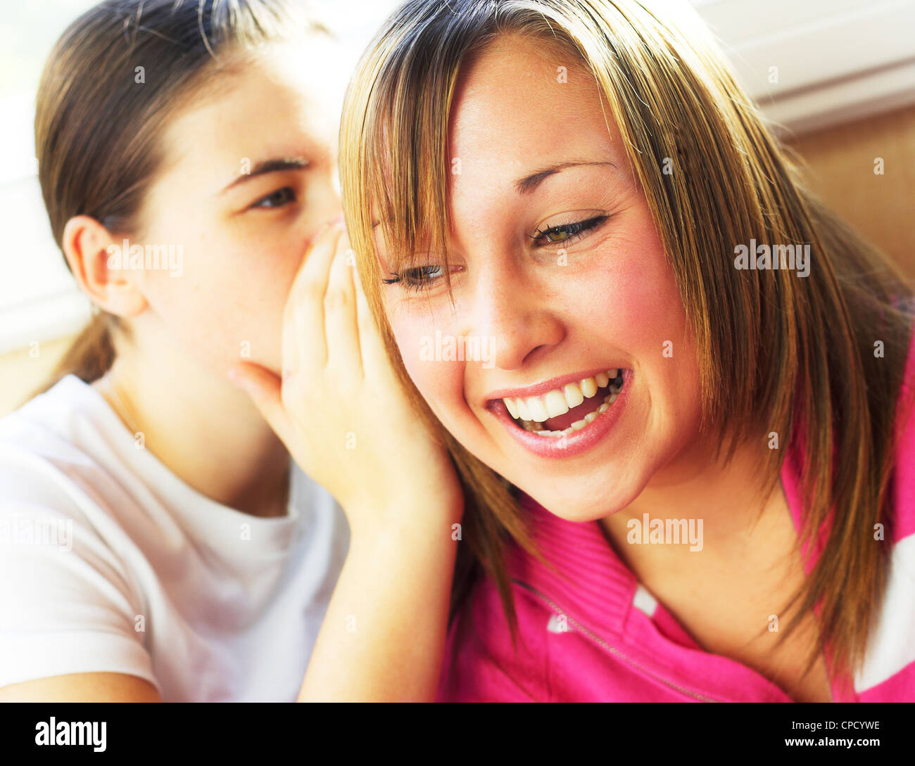 Two teenage girls gossiping Stock Photo