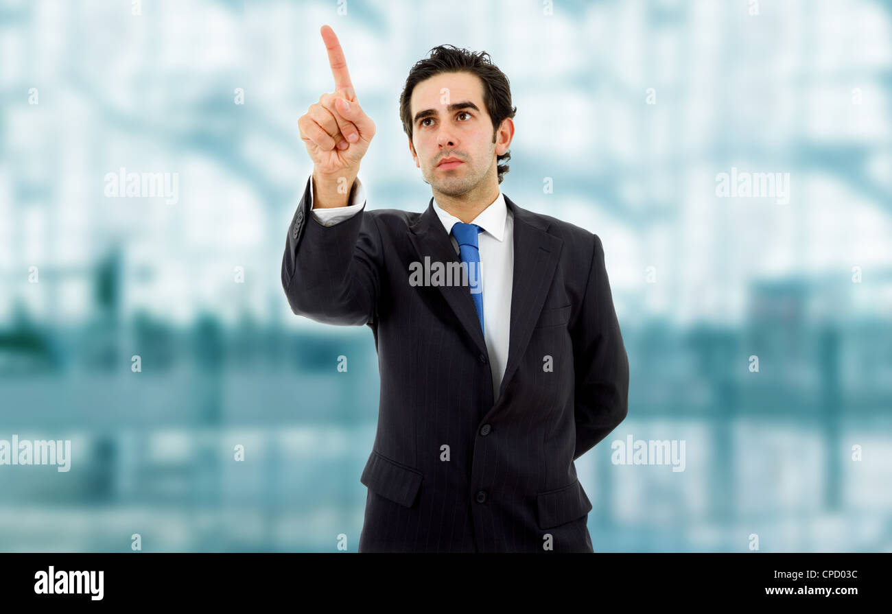 young business man in a suit pointing with his finger Stock Photo - Alamy