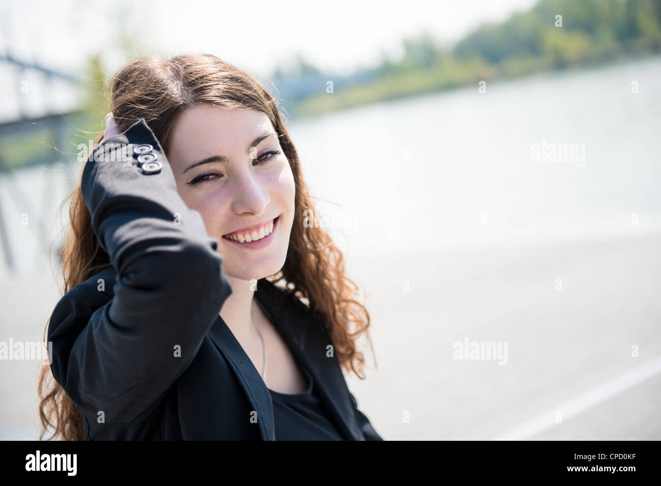 Young smiling happy woman - outdoor sunny portrait Stock Photo - Alamy